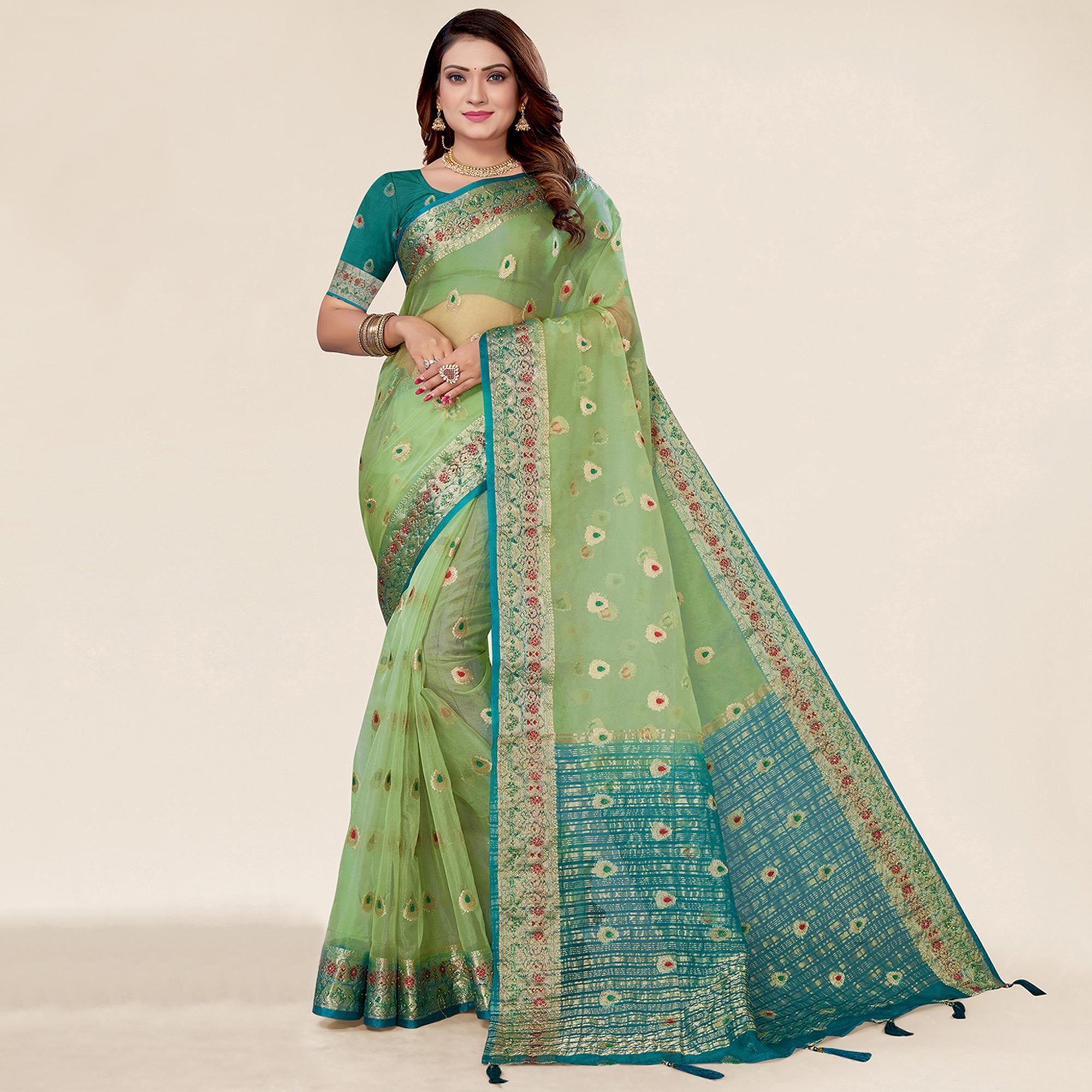 Pista Green Woven Organza Saree With Tassels