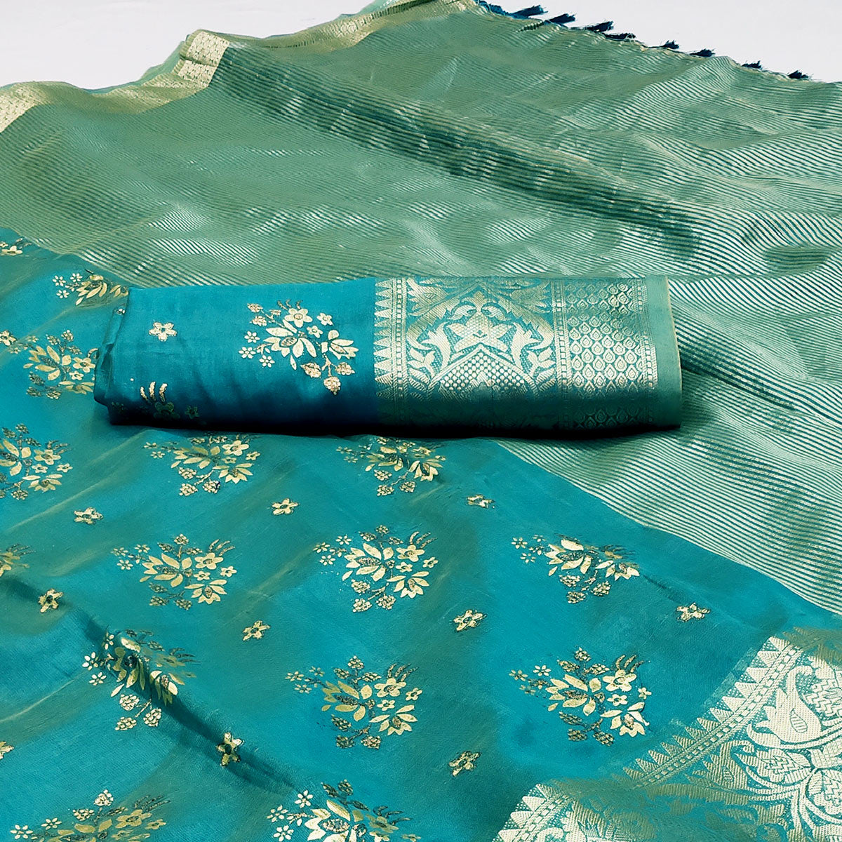 Rama Blue Woven Organza Saree With Tassels