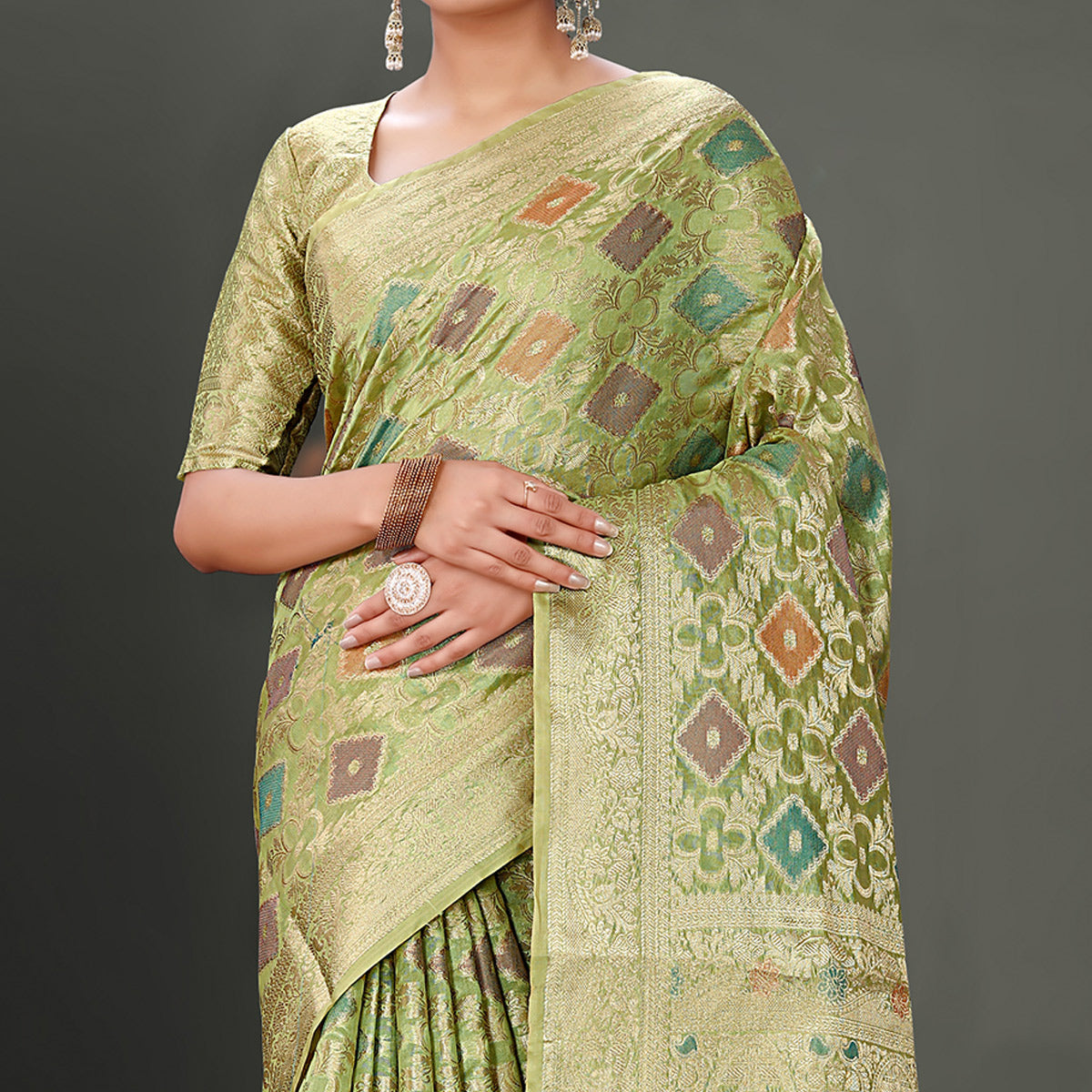 Green Woven Organza Saree With Tassels
