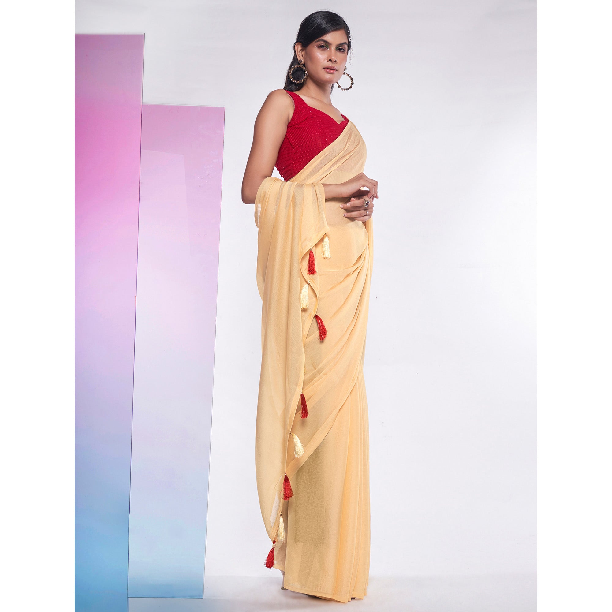 Yellow Solid Georgette Saree With Tassels