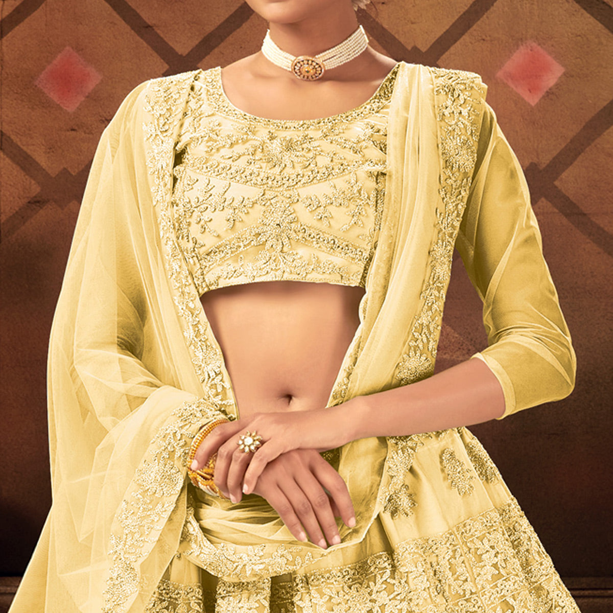 Yellow Embroidered Netted Lehenga Choli