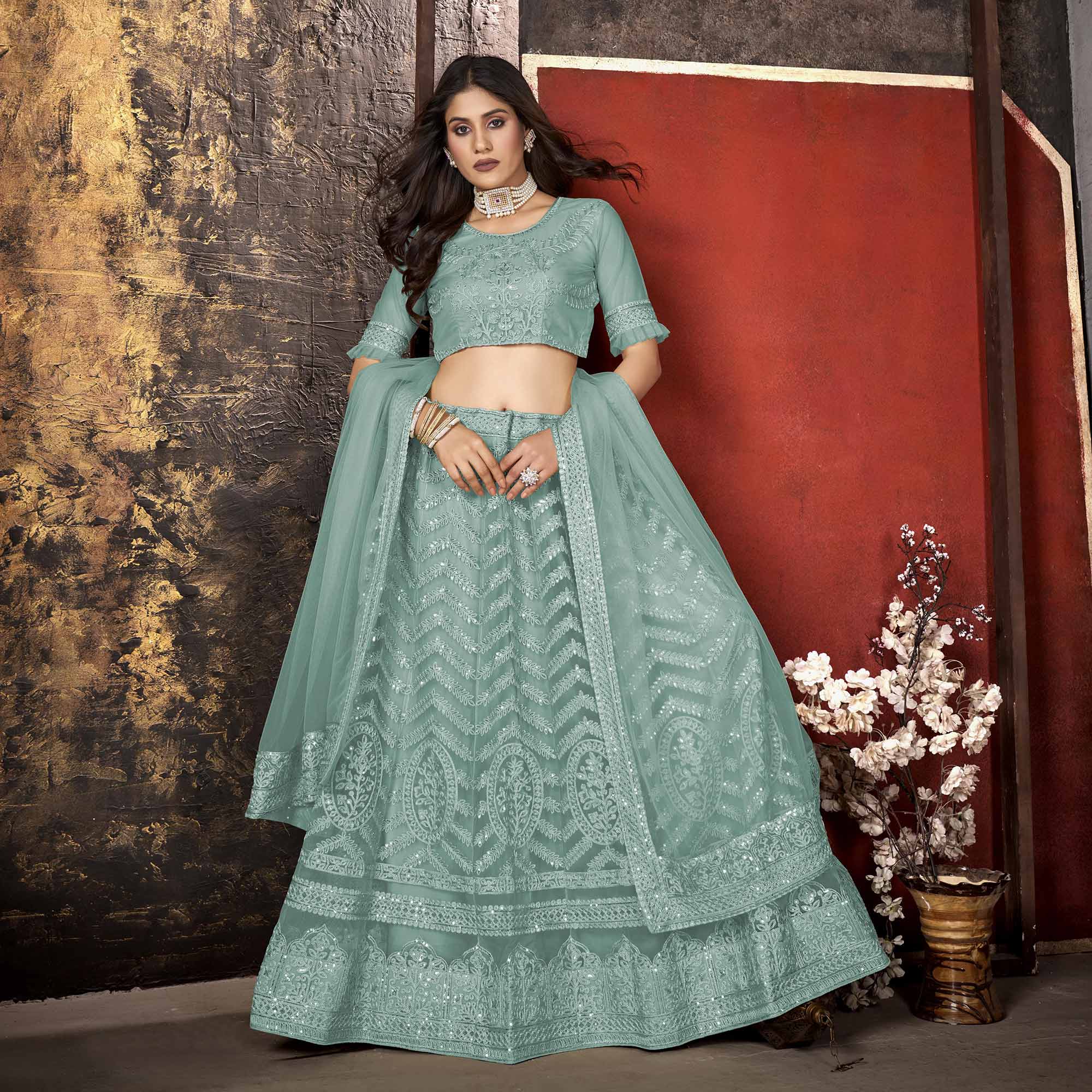 Sea Blue Heavy Embroidered Netted Lehenga Choli