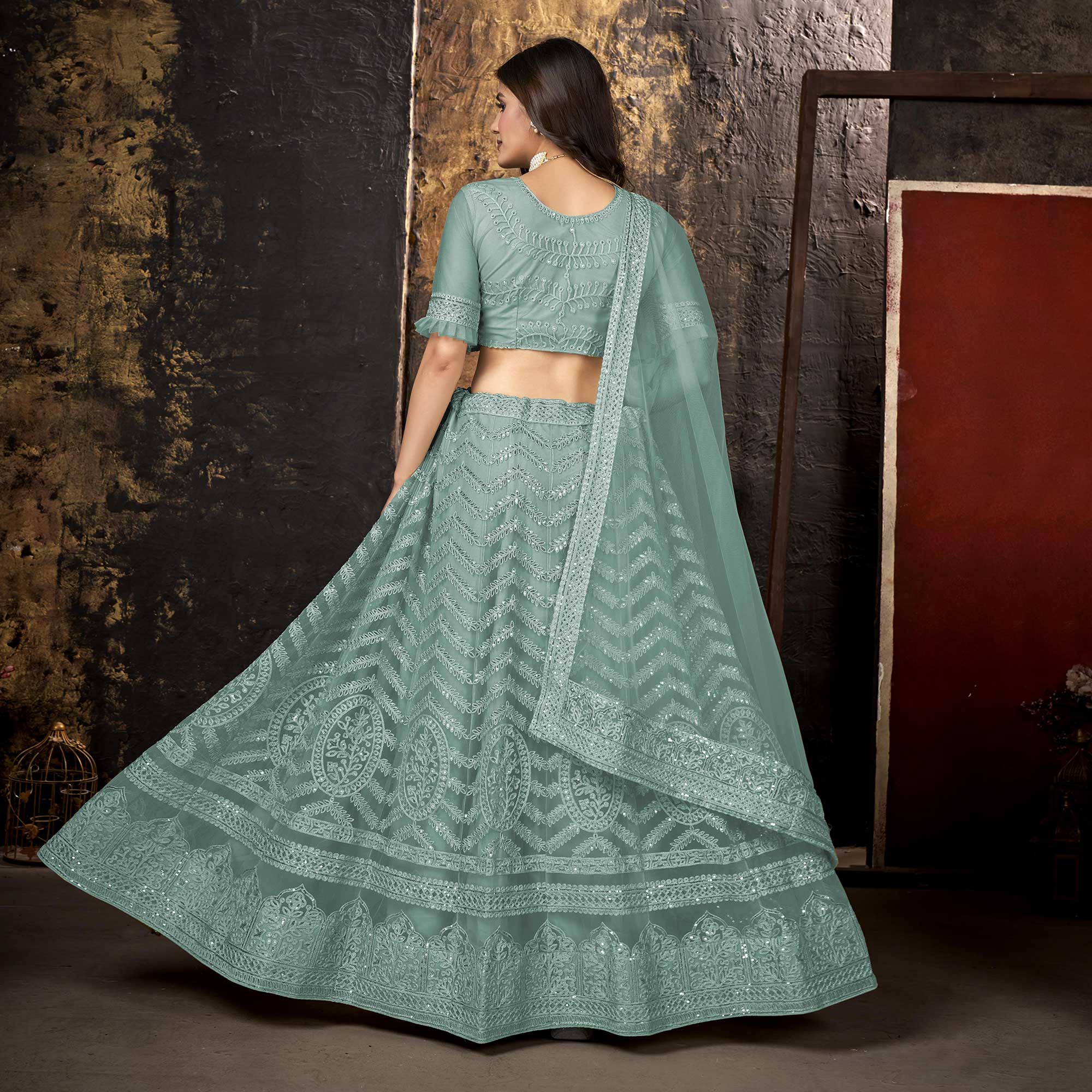 Sea Blue Heavy Embroidered Netted Lehenga Choli