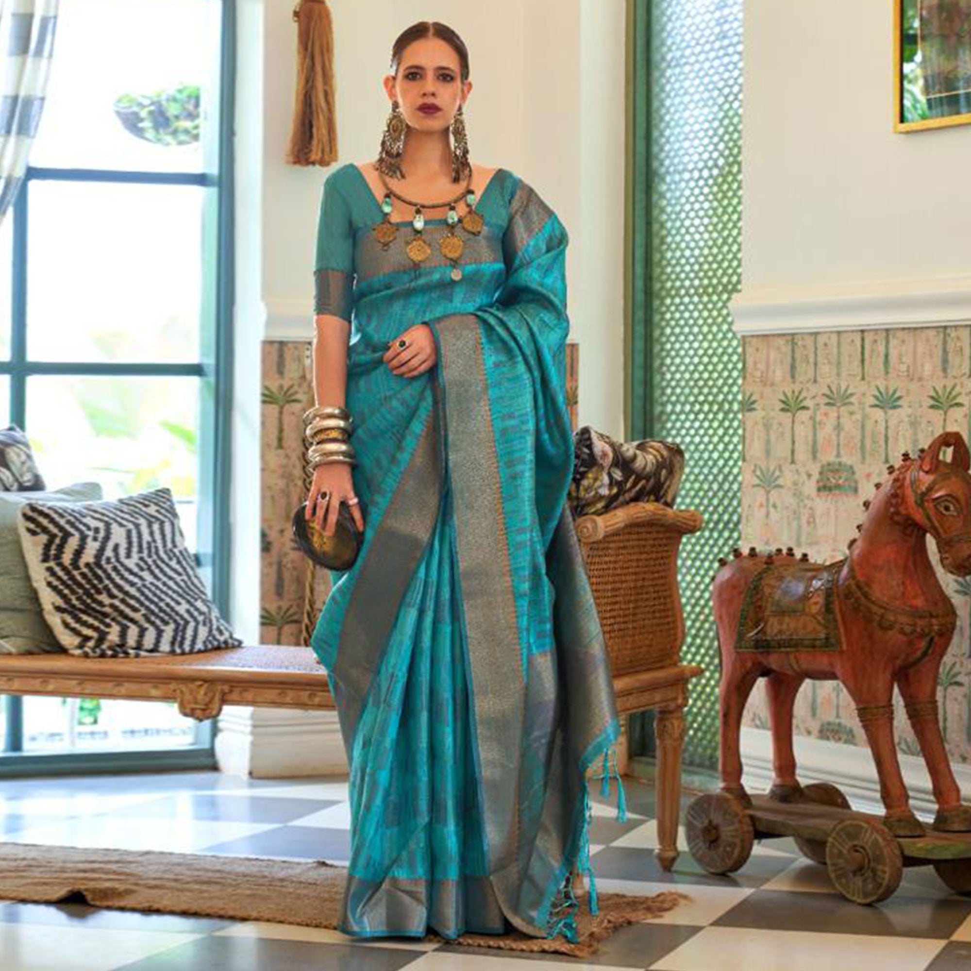 Firozi Blue Woven Organza Saree With Tassels