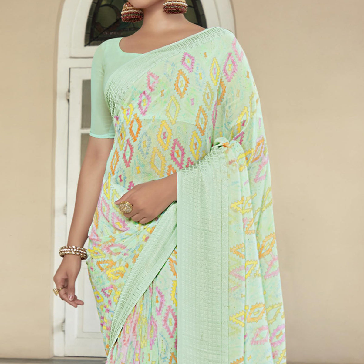 Sea Green Printed Georgette Saree With Checks Border