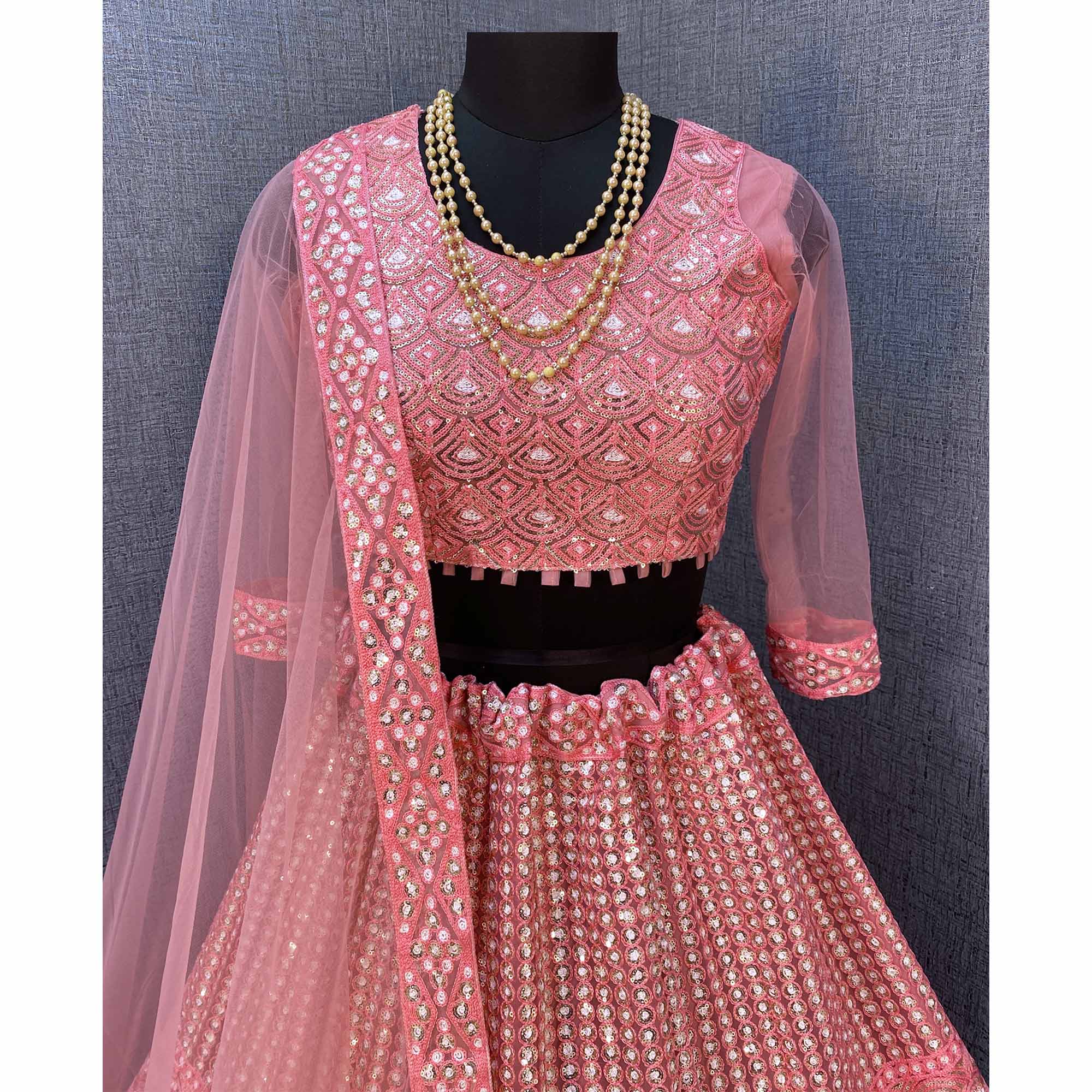 Pink Sequins Embroidered Netted Lehenga Choli