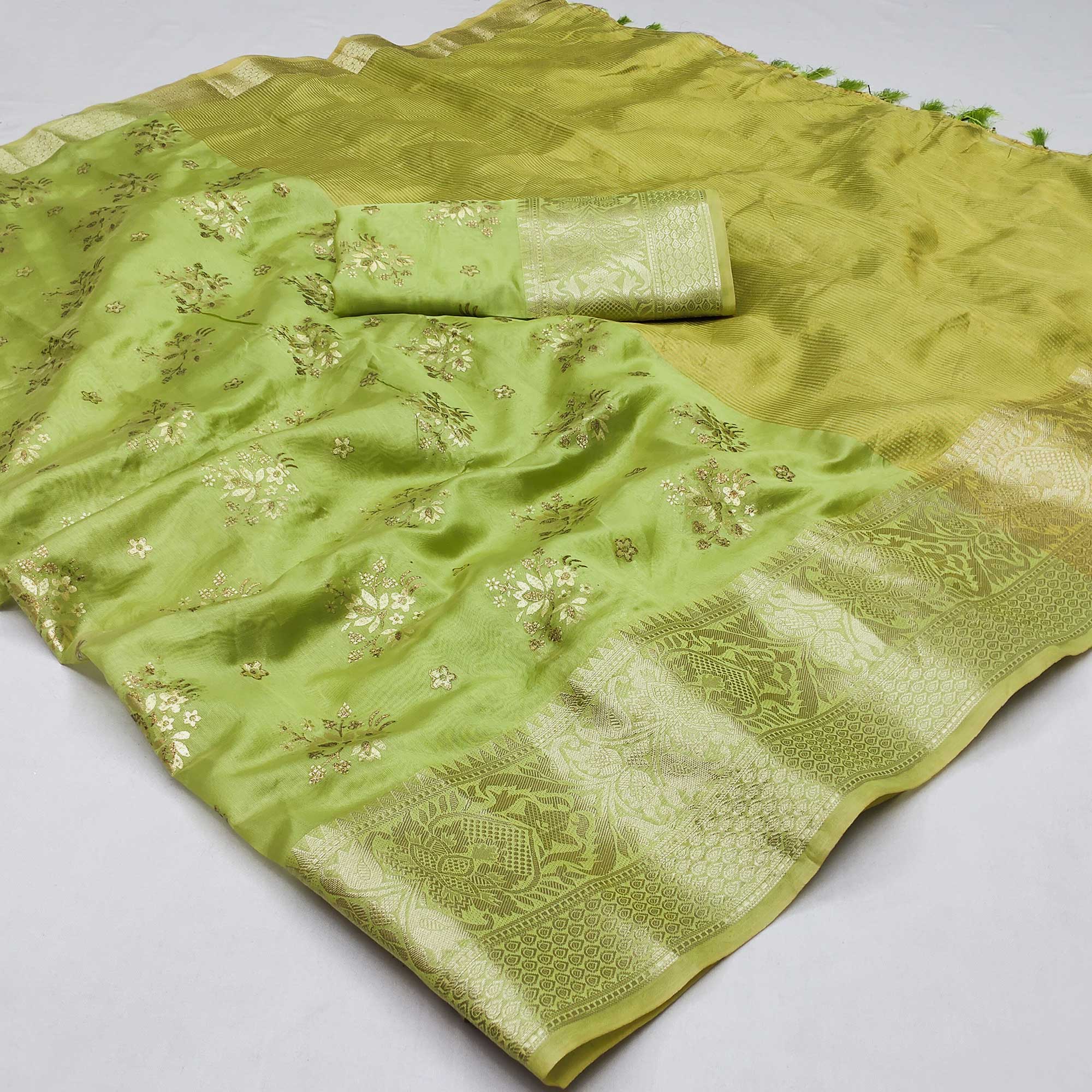 Green Woven Organza Saree With Tassels