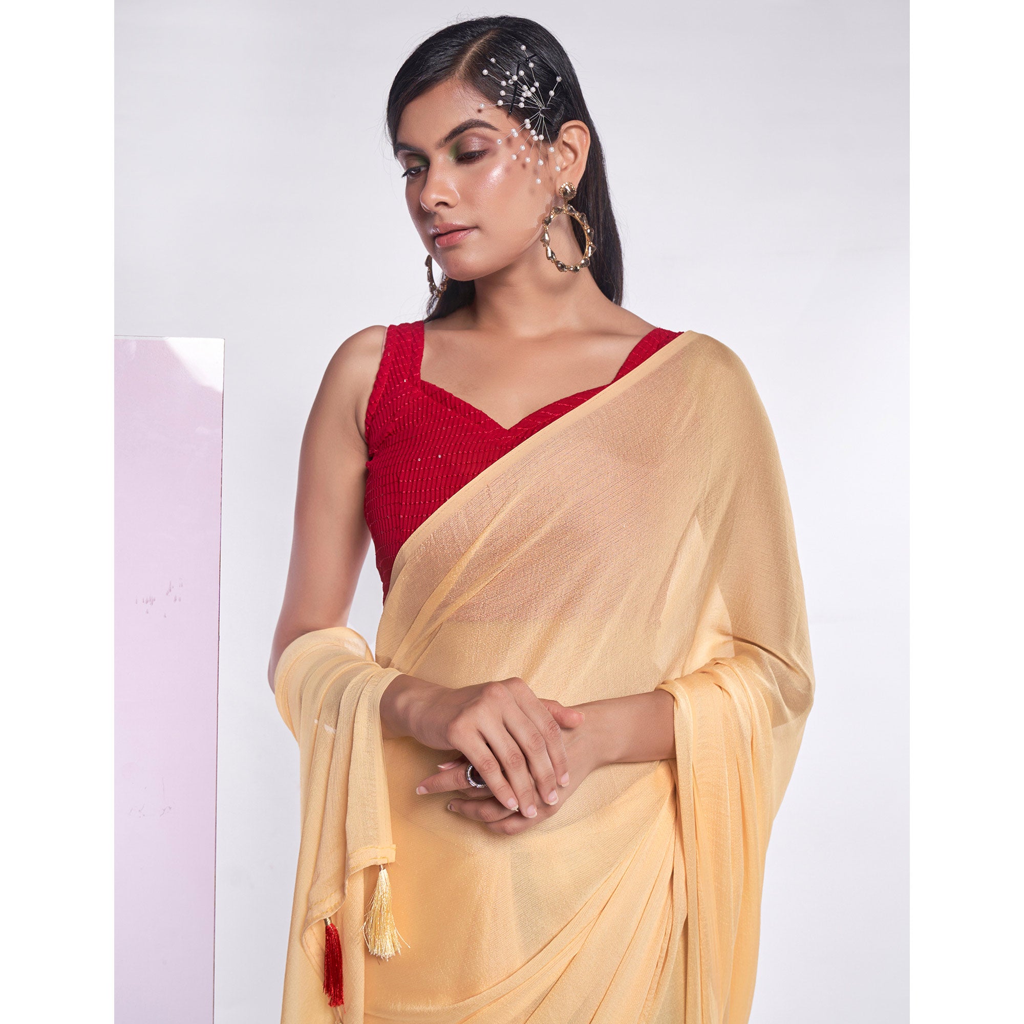 Yellow Solid Georgette Saree With Tassels