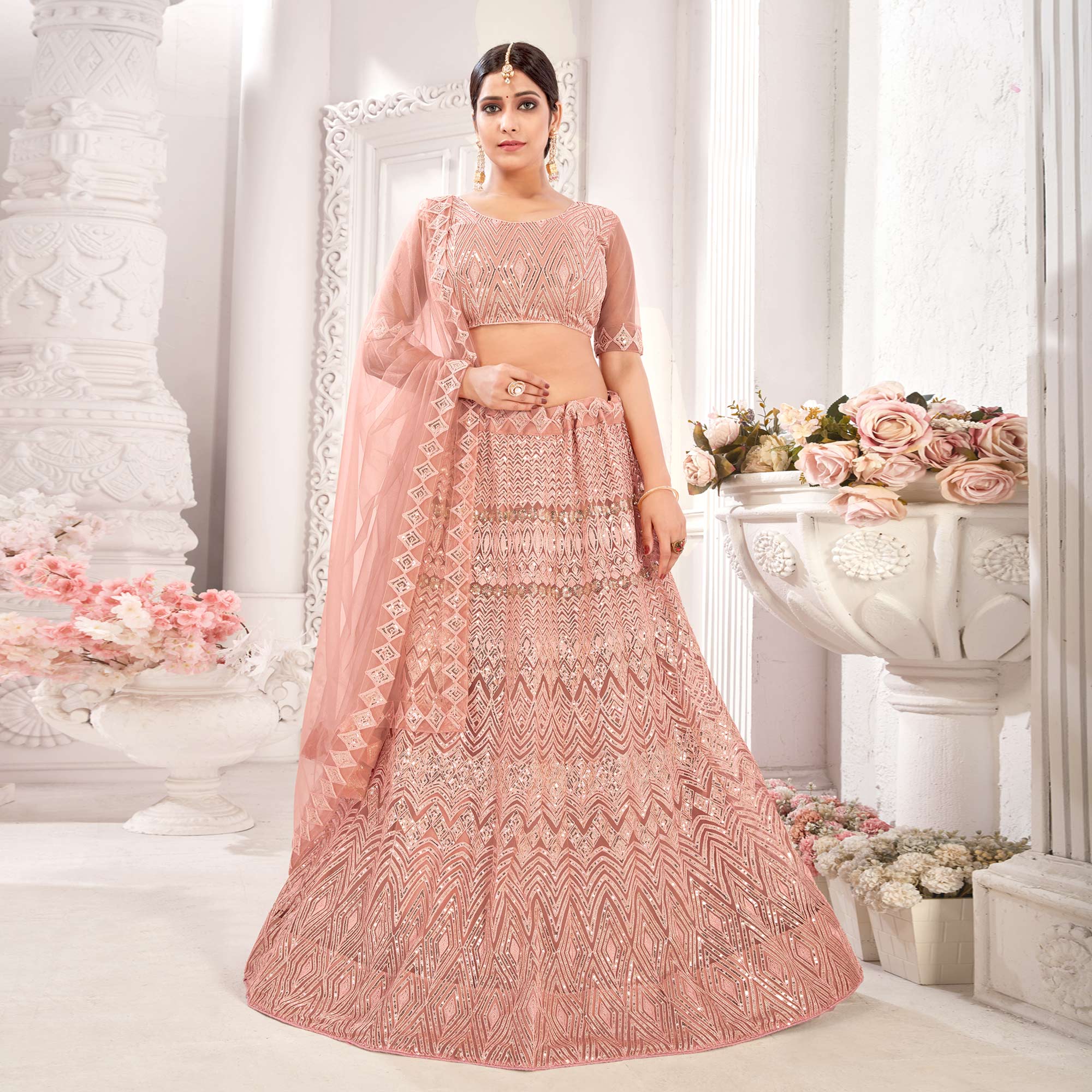 Peach Sequins Embroidered Netted Lehenga Choli