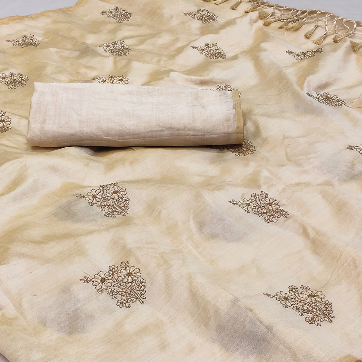 Cream Floral Embroidered Assam Silk Saree With Tassels