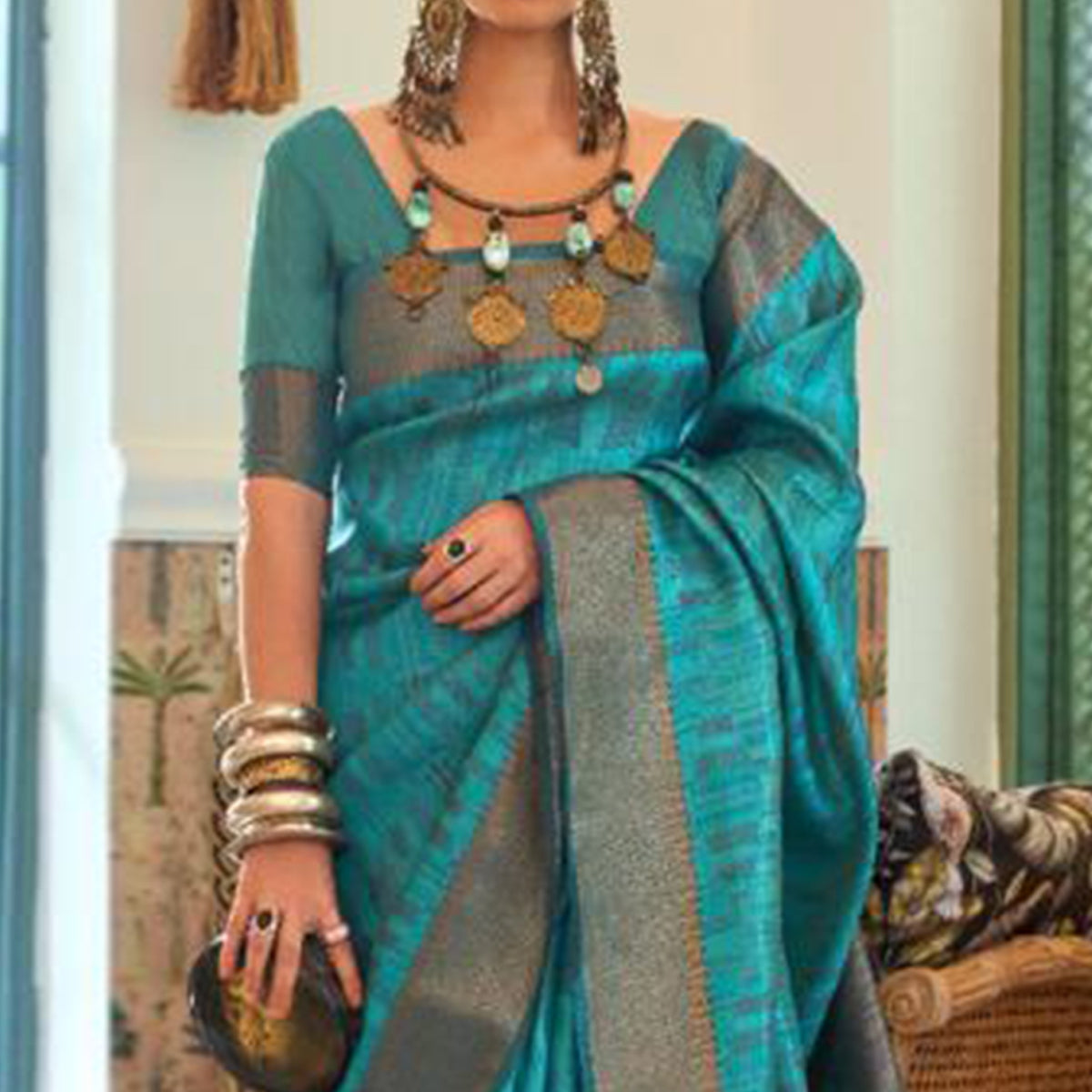 Firozi Blue Woven Organza Saree With Tassels