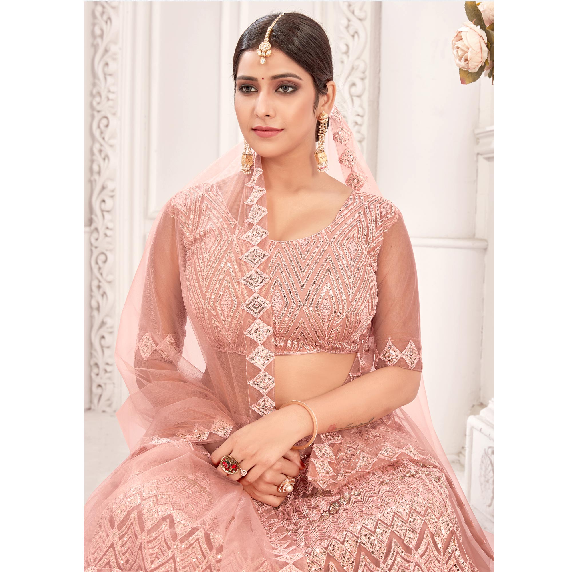 Peach Sequins Embroidered Netted Lehenga Choli