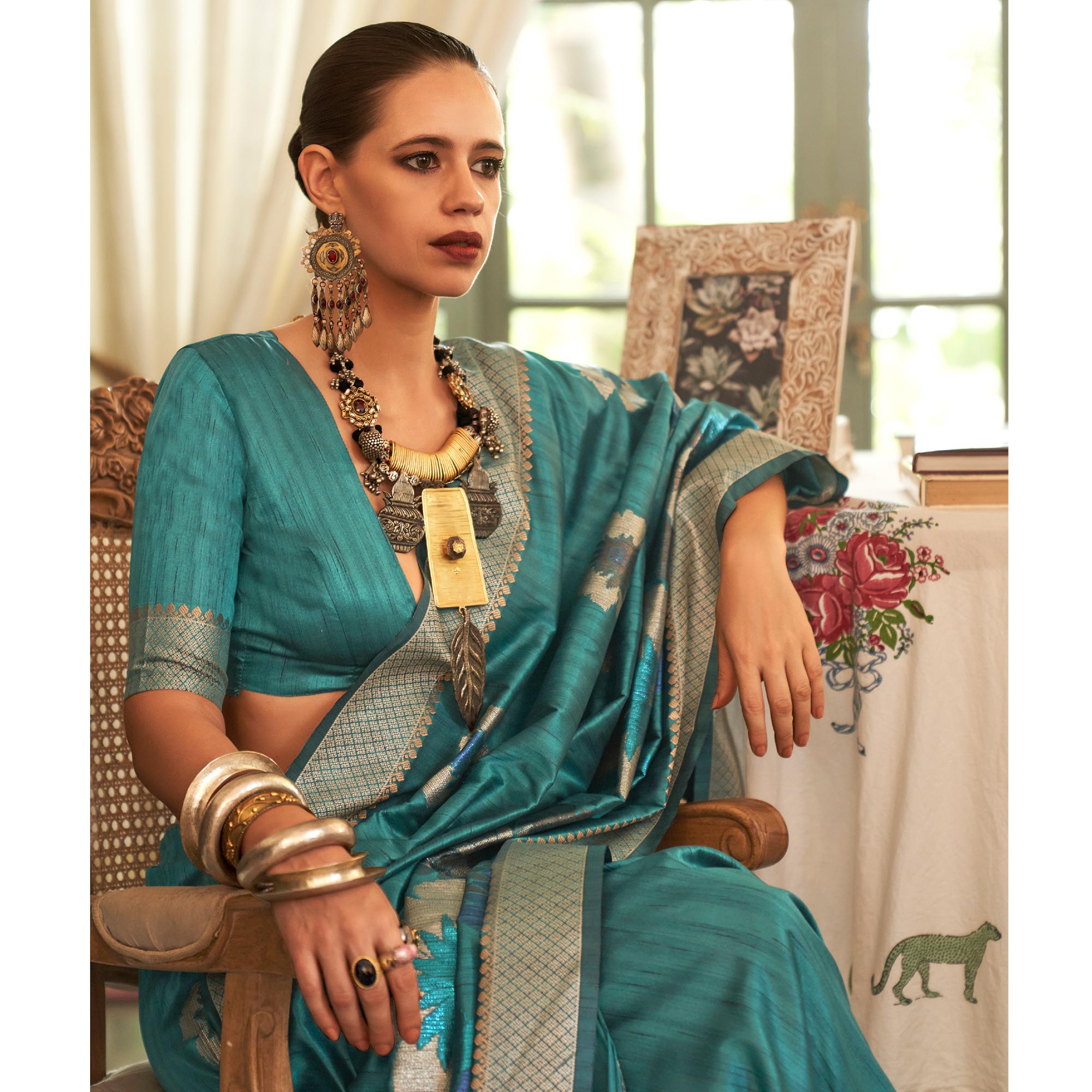 Turquoise Woven Art Silk Saree With Tassels