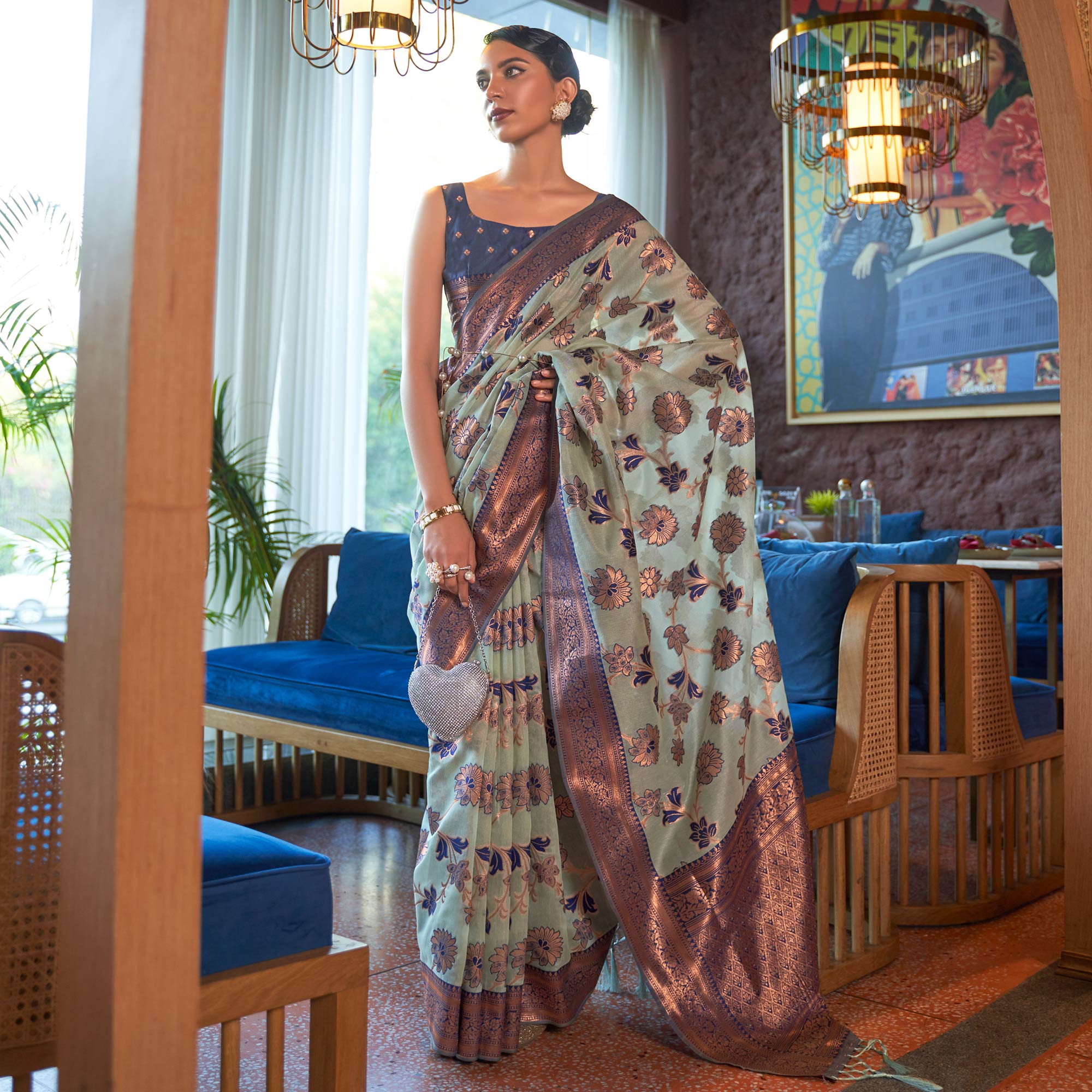 Pista Green Woven Organza Saree With Tassels