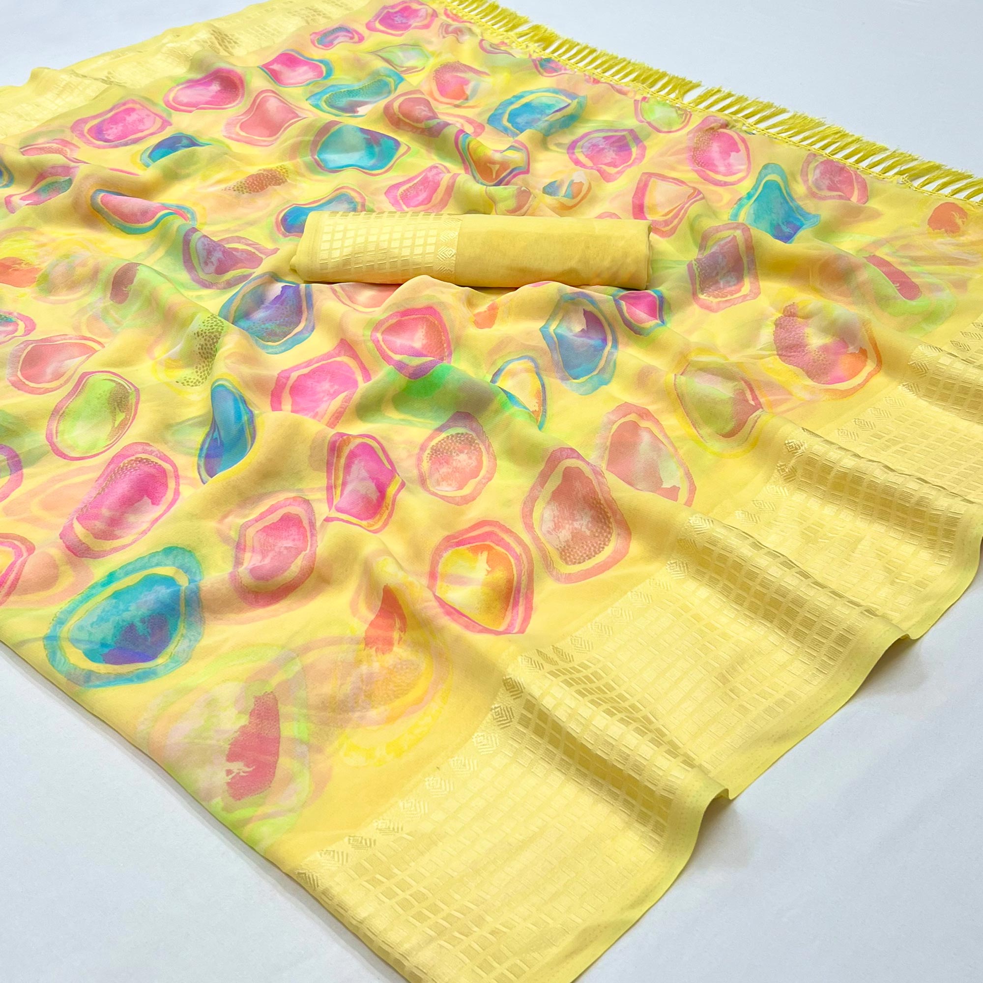 Yellow Printed Georgette Saree With Tassels