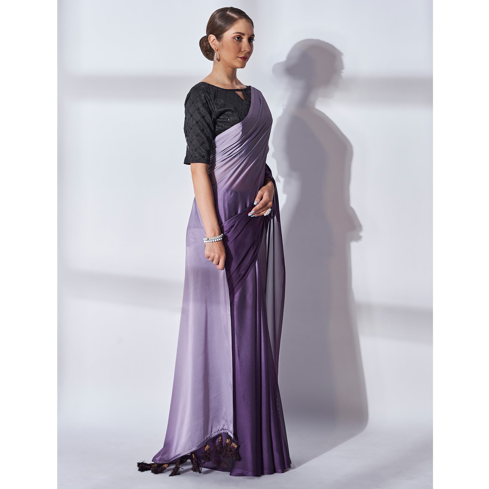 Purple Solid Georgette Saree With Tassels