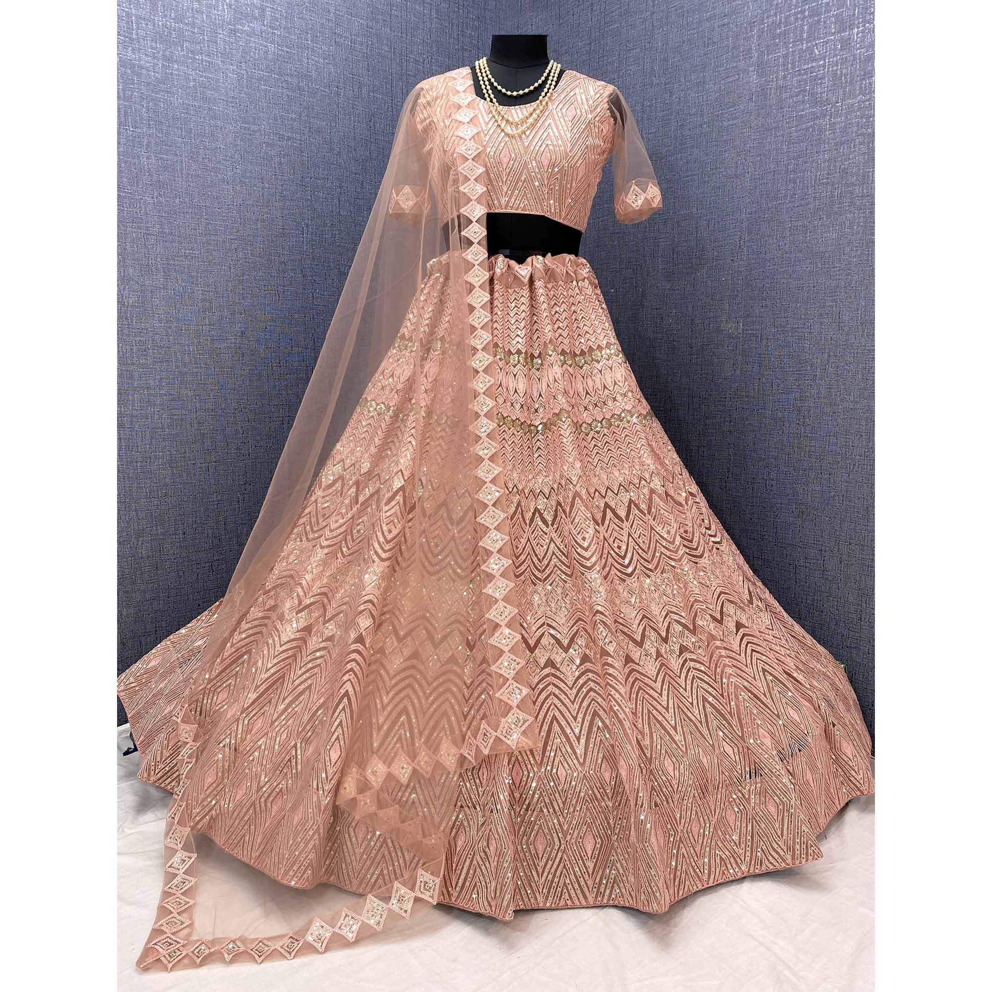 Peach Sequins Embroidered Netted Lehenga Choli