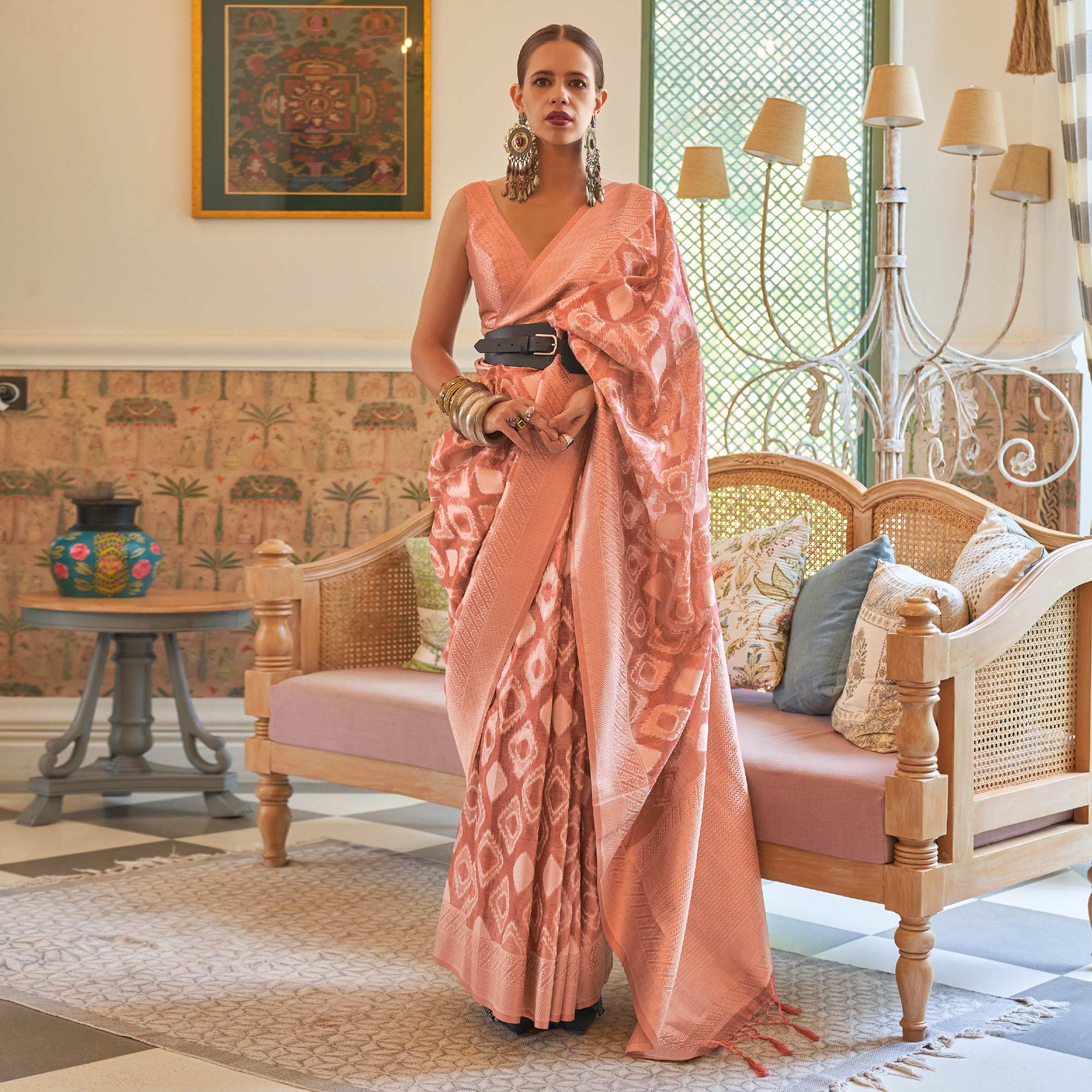 Salmon Pink Woven Art Silk Saree With Tassels