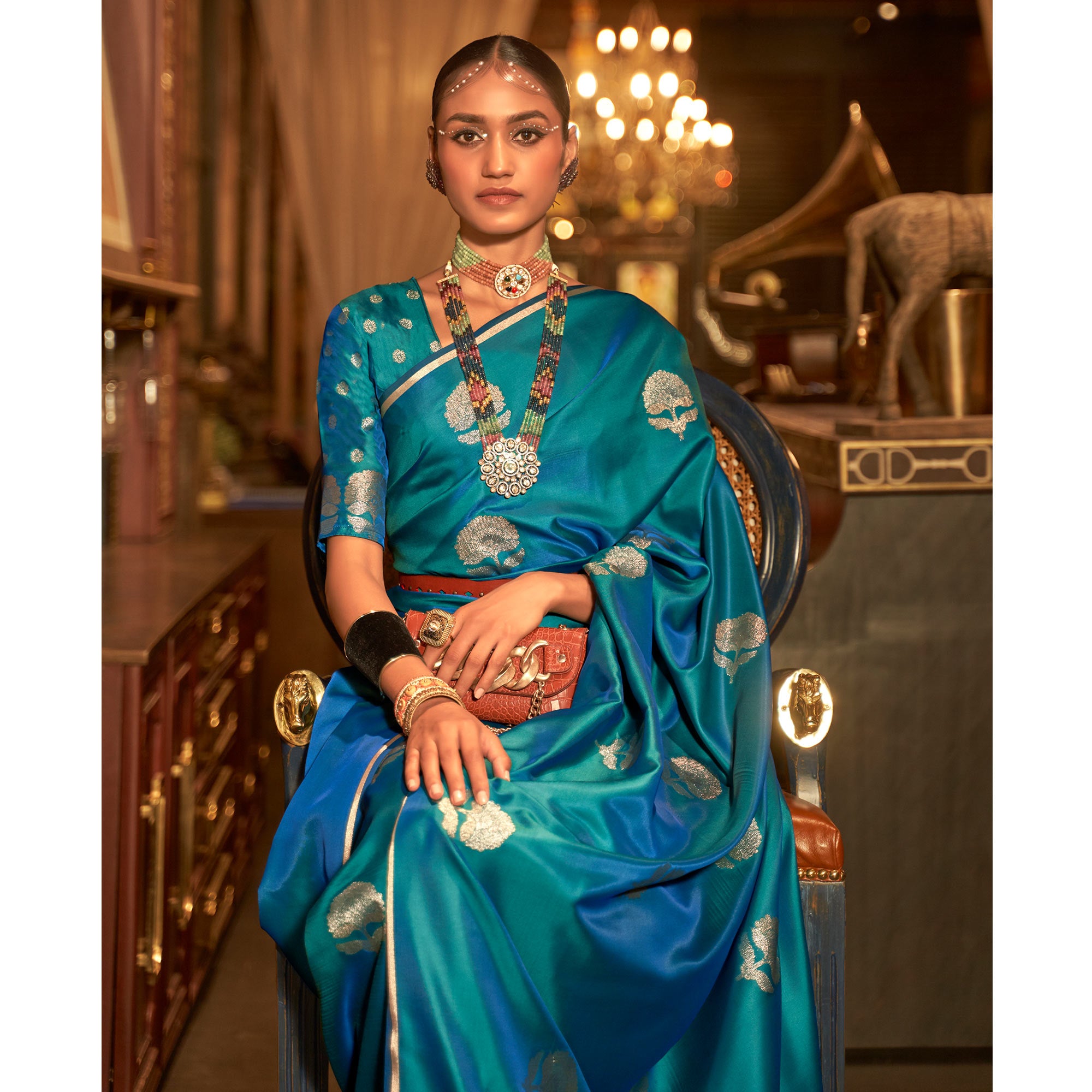 Teal Blue Floral Woven Satin Saree With Tassels