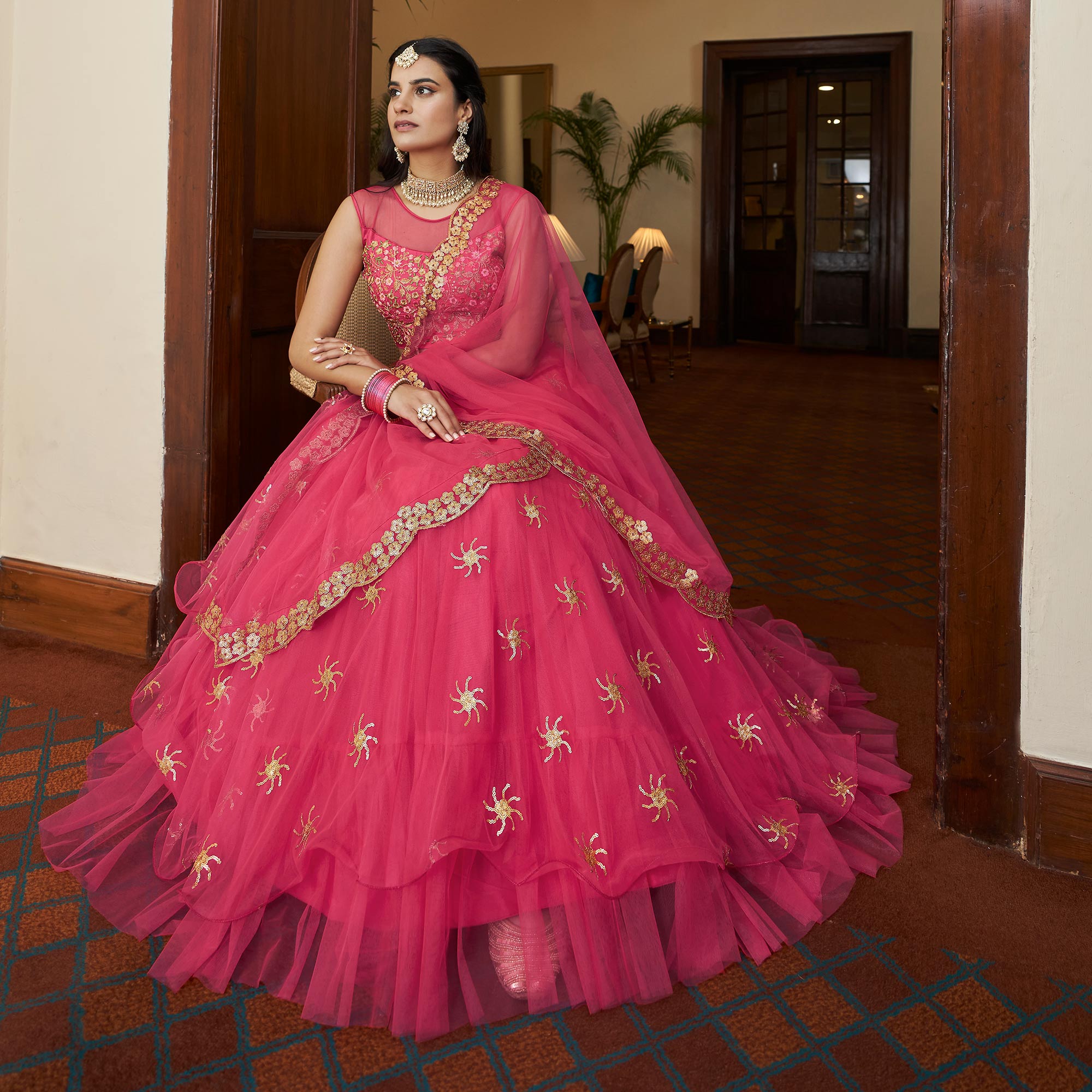 Bright Pink Sequins Embroidered Netted Lehenga Choli