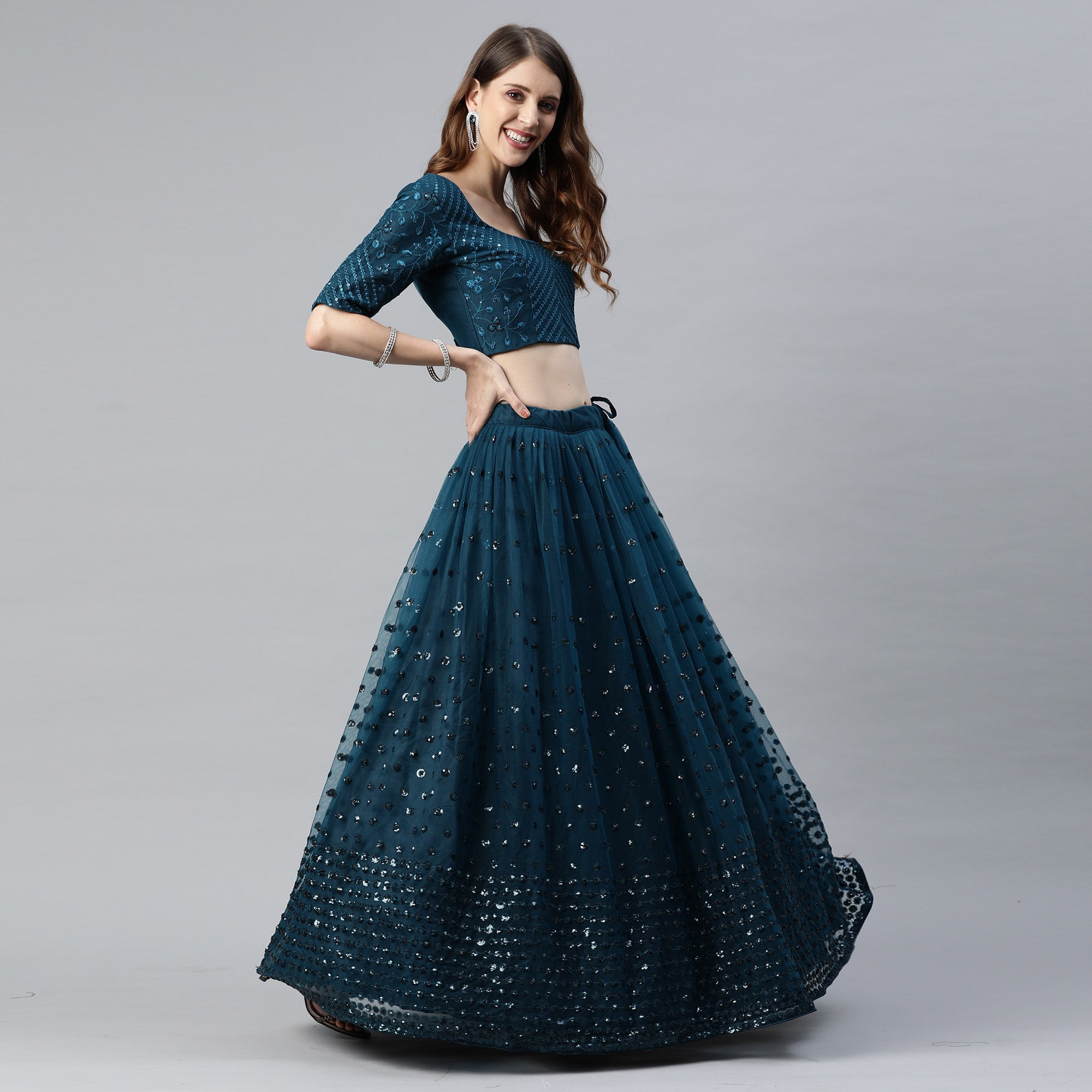 Teal Blue Sequins Embroidered Net Lehenga Choli