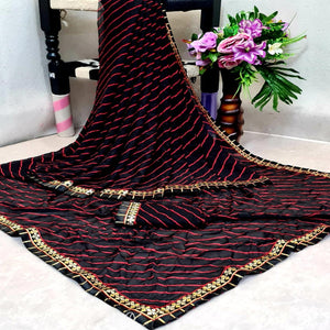 Flamboyant Black Colored Casual Printed Moss Georgette Saree - Peachmode