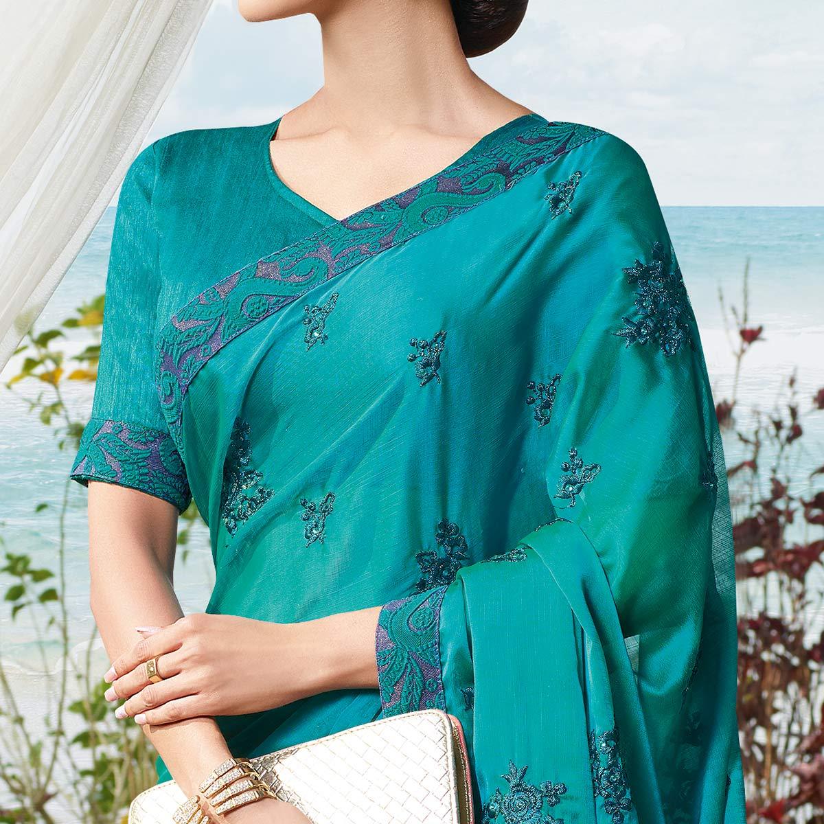 Flamboyant Rama Blue Colored Partywear Embroidered Georgette Saree - Peachmode