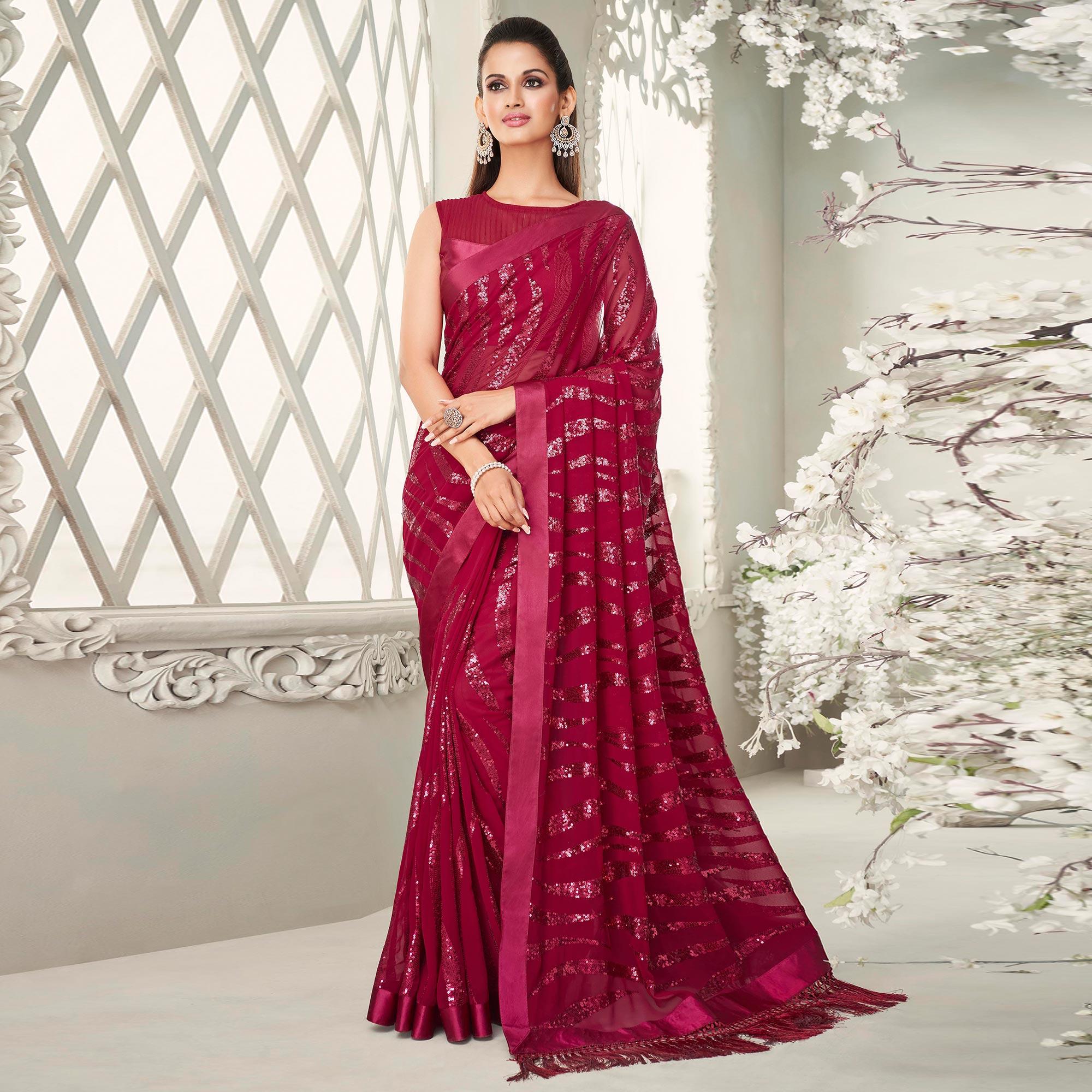 Fuchsia Pink Sequence Embroidered Georgette Saree With Tassels - Peachmode