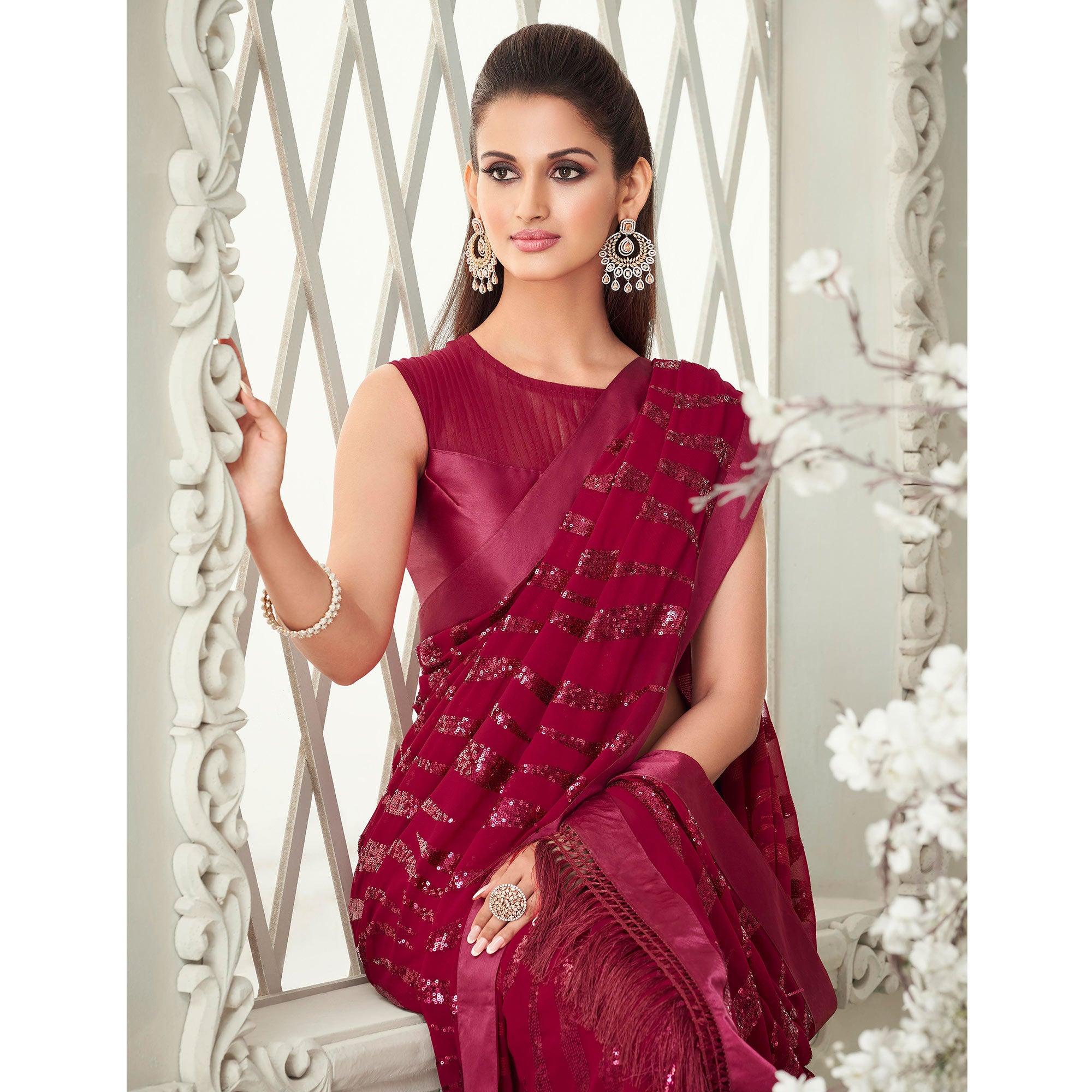 Fuchsia Pink Sequence Embroidered Georgette Saree With Tassels - Peachmode