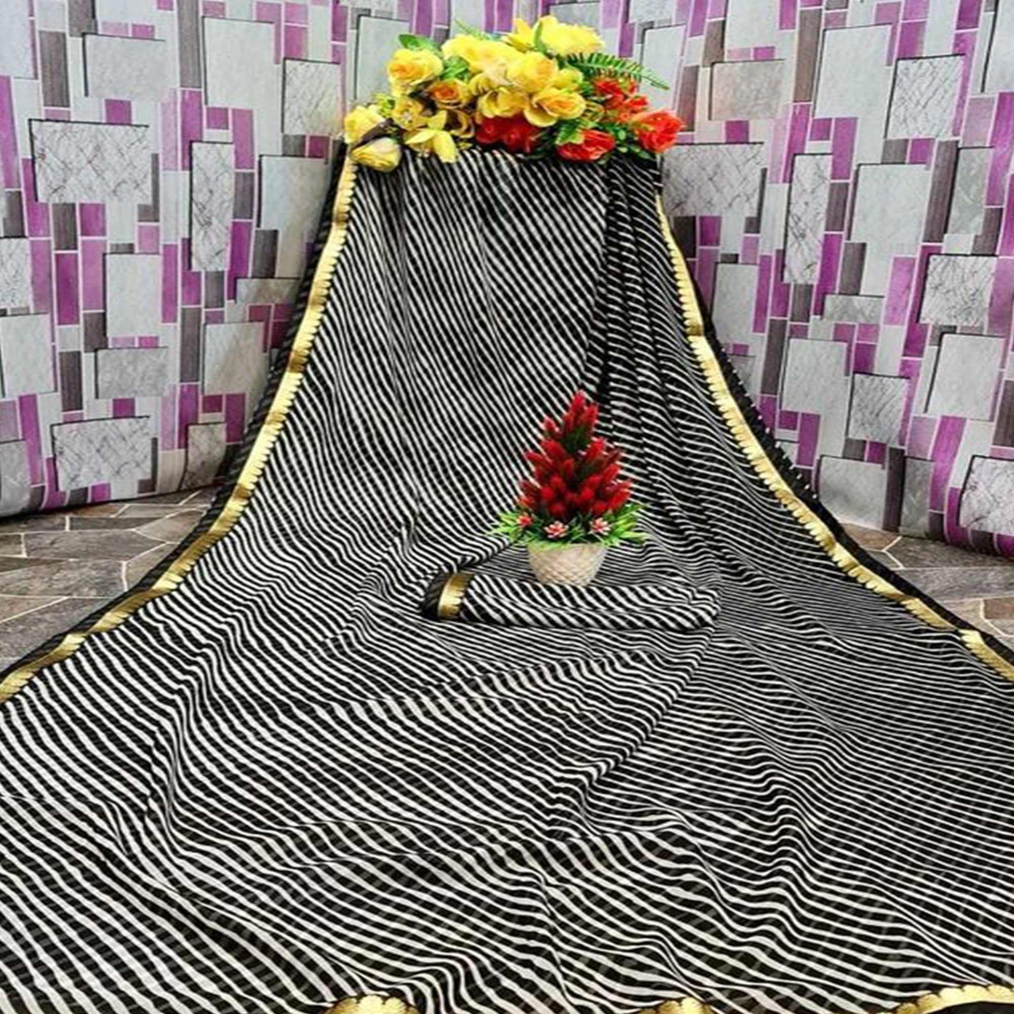 Gleaming Cream & Black Coloured Casual Wear Printed Georgette Saree - Peachmode