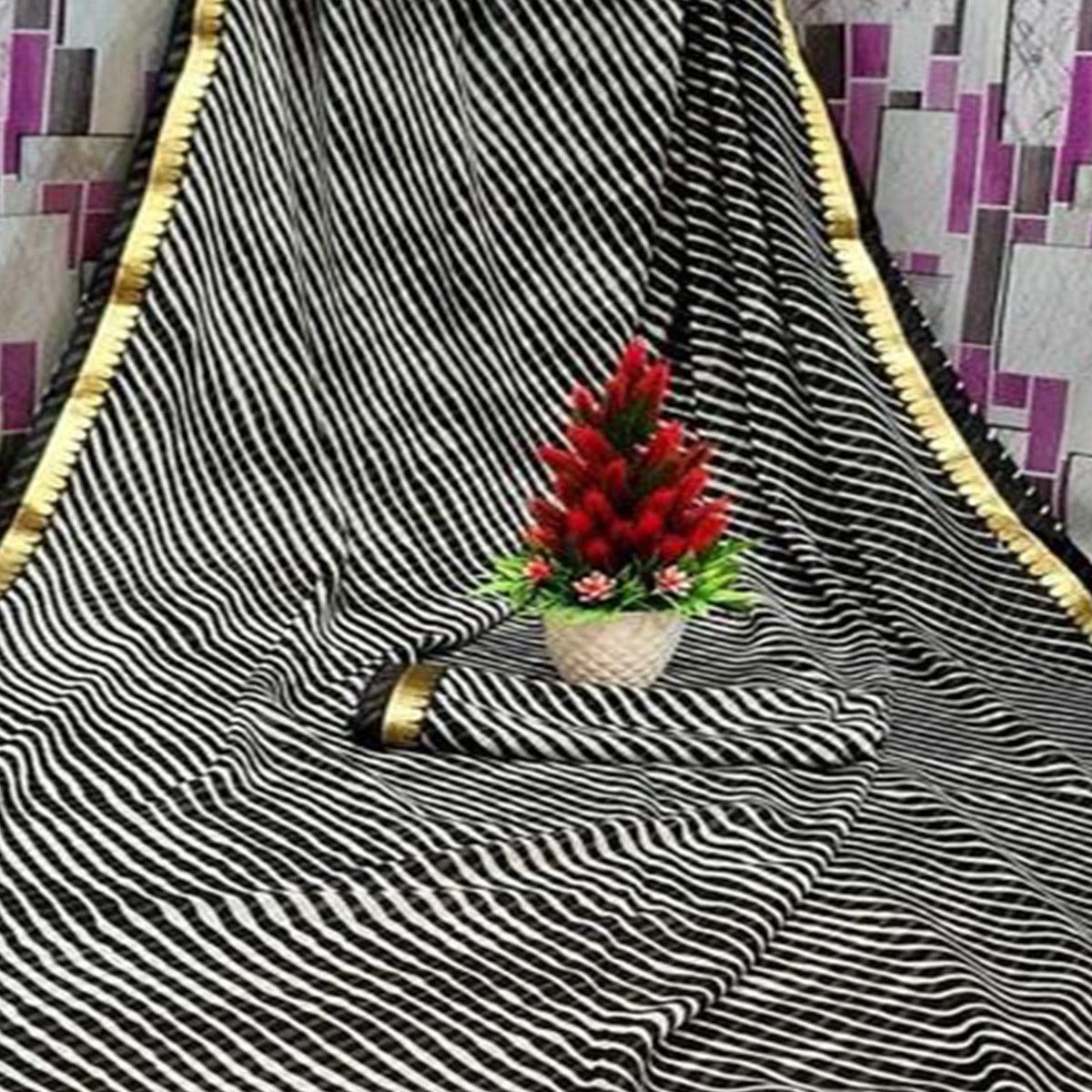 Gleaming Cream & Black Coloured Casual Wear Printed Georgette Saree - Peachmode