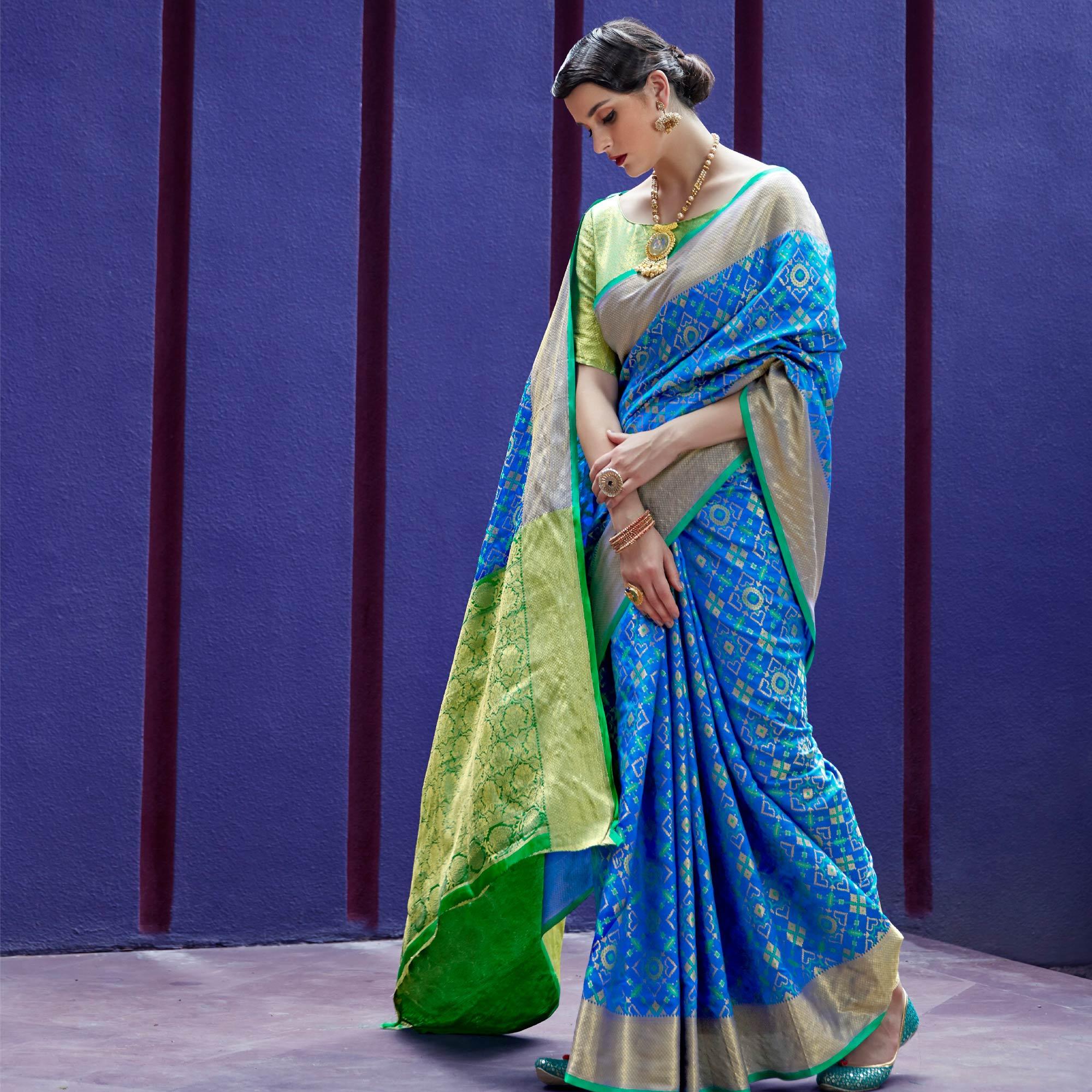 Glowing Blue Colored Festive Wear Woven Indian Patola Silk Saree - Peachmode