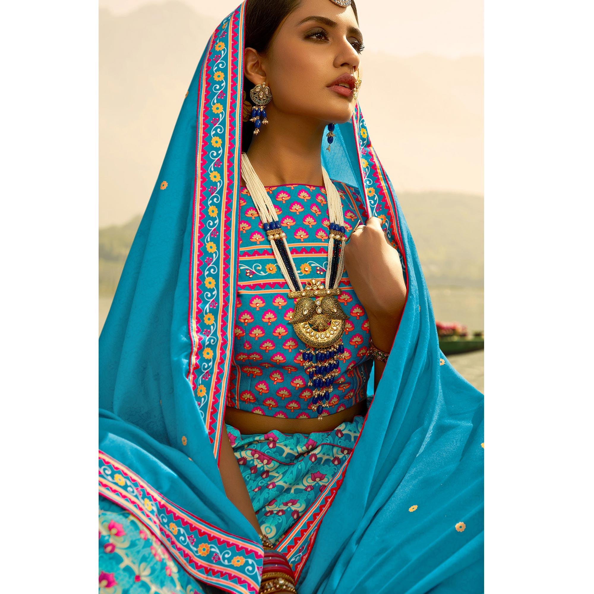 Glowing Sky Blue Coloured Wedding Wear Designer Stone Work Heavy Silk Lehenga Choli - Peachmode