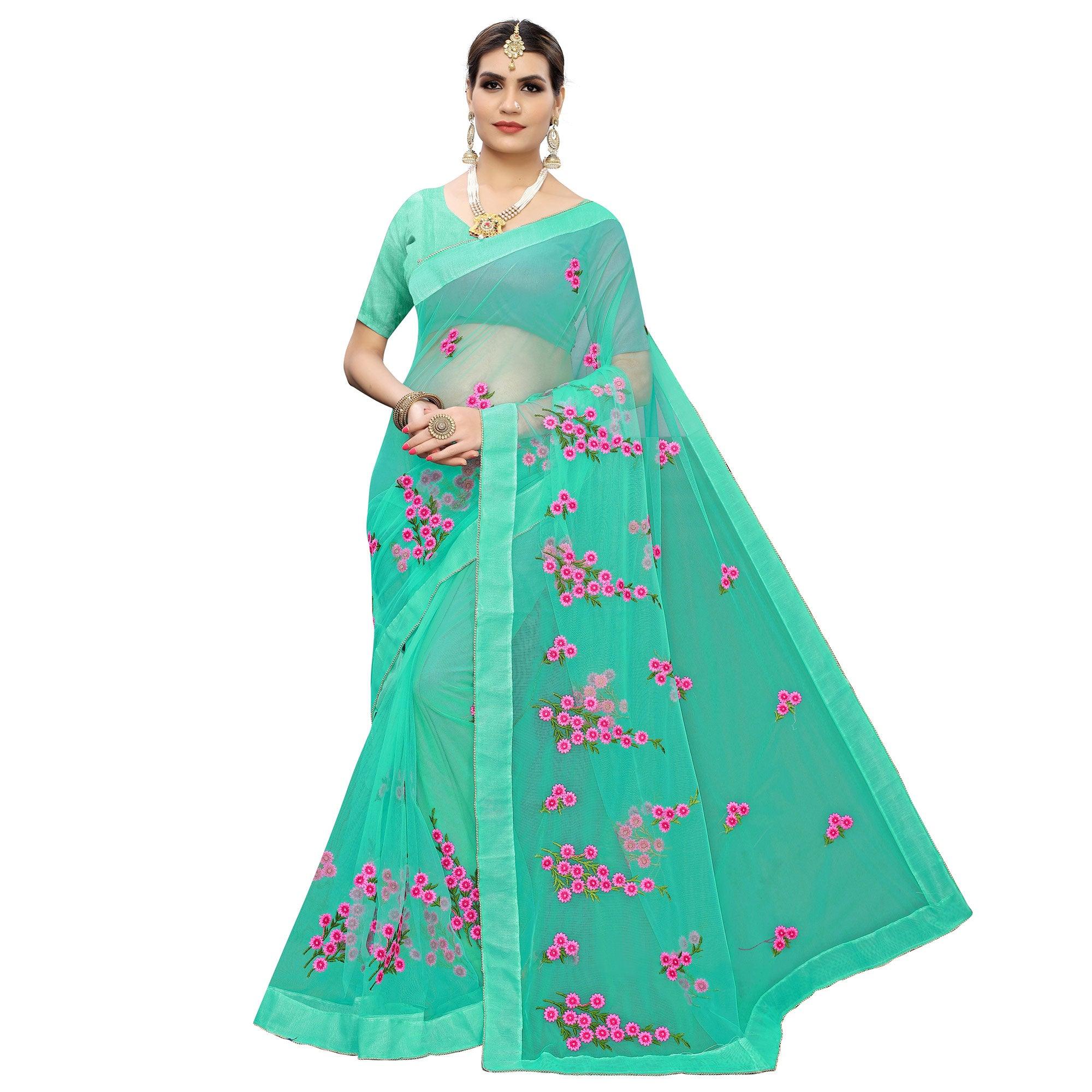 Glowing Turquoise Green Colored Embroidered Net Saree - Peachmode