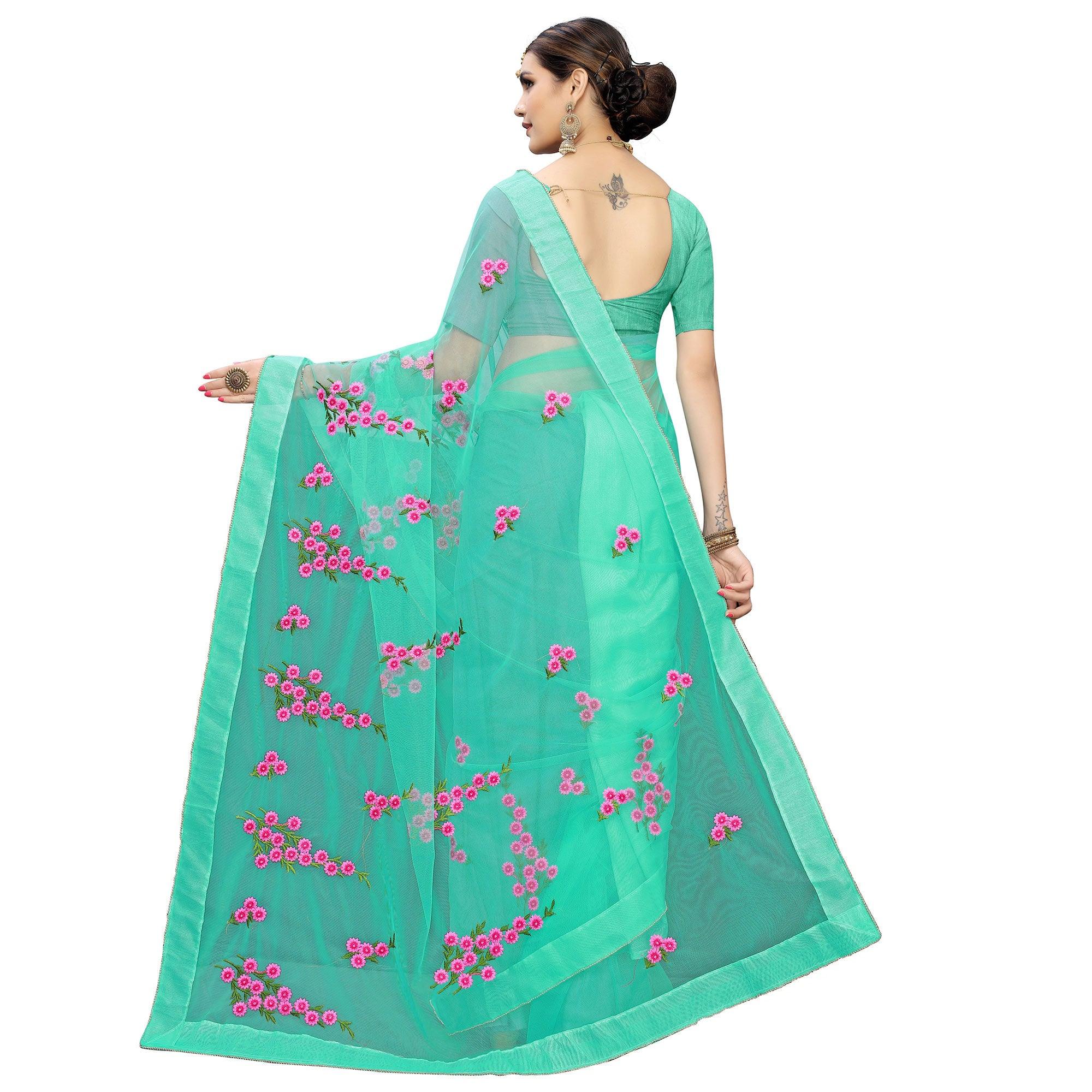 Glowing Turquoise Green Colored Embroidered Net Saree - Peachmode