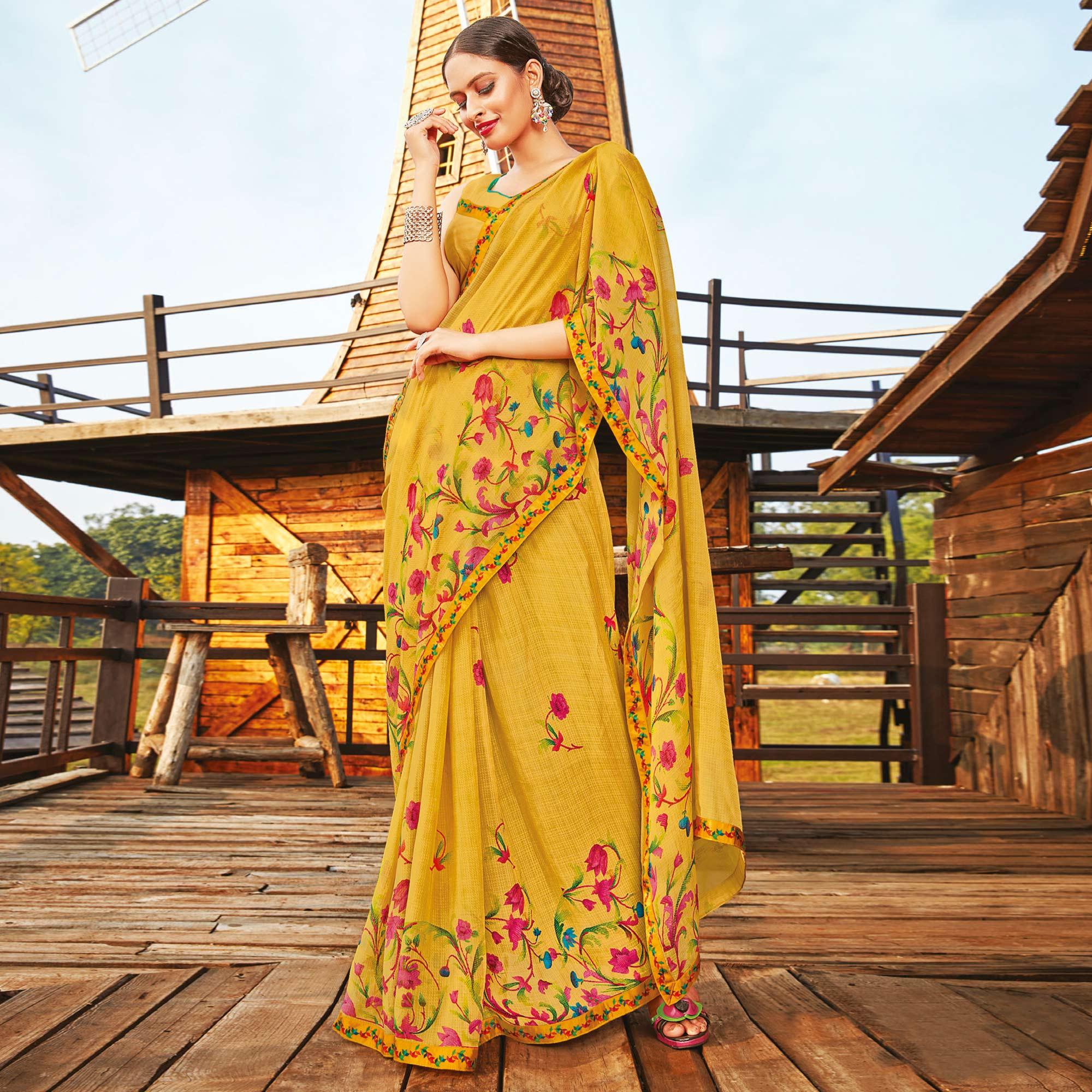 Gorgeous Mustard Coloured Partywear Pure Georgette Floral Printed Saree With Fancy Lace Border - Peachmode