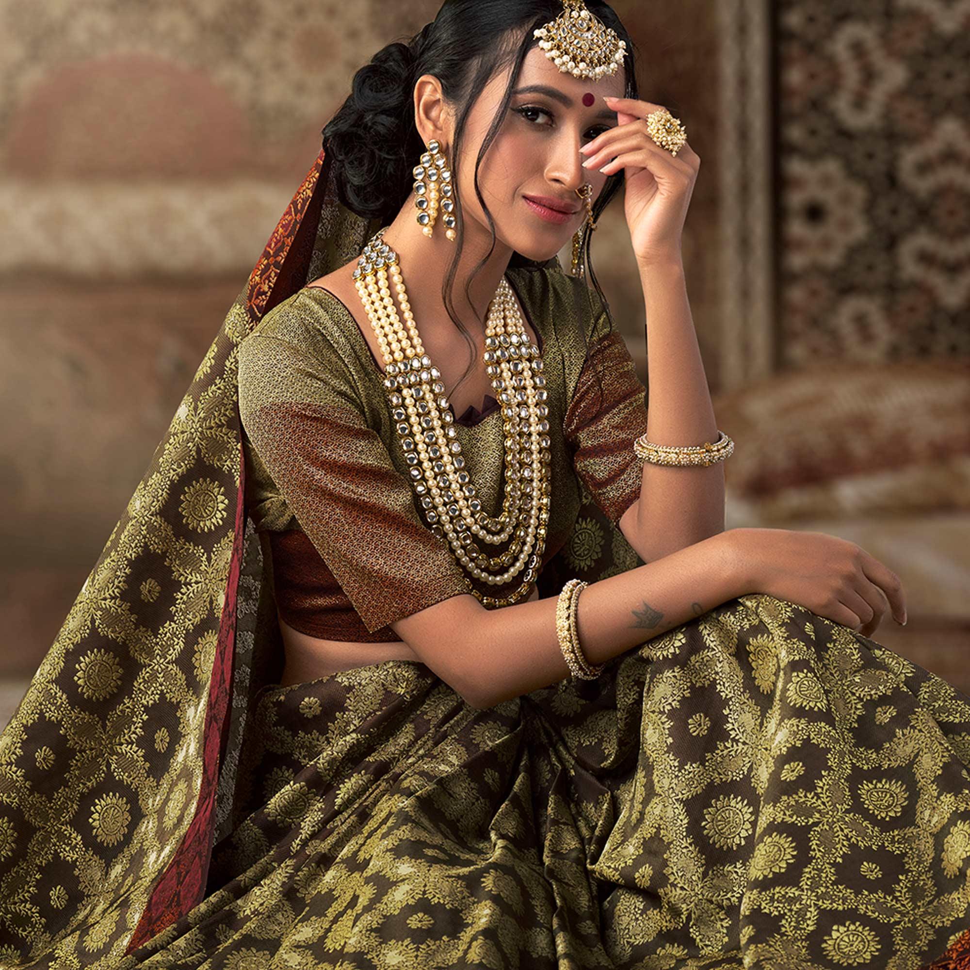 Gorgeous Olive Green Colored Festive Wear Woven Silk Saree - Peachmode
