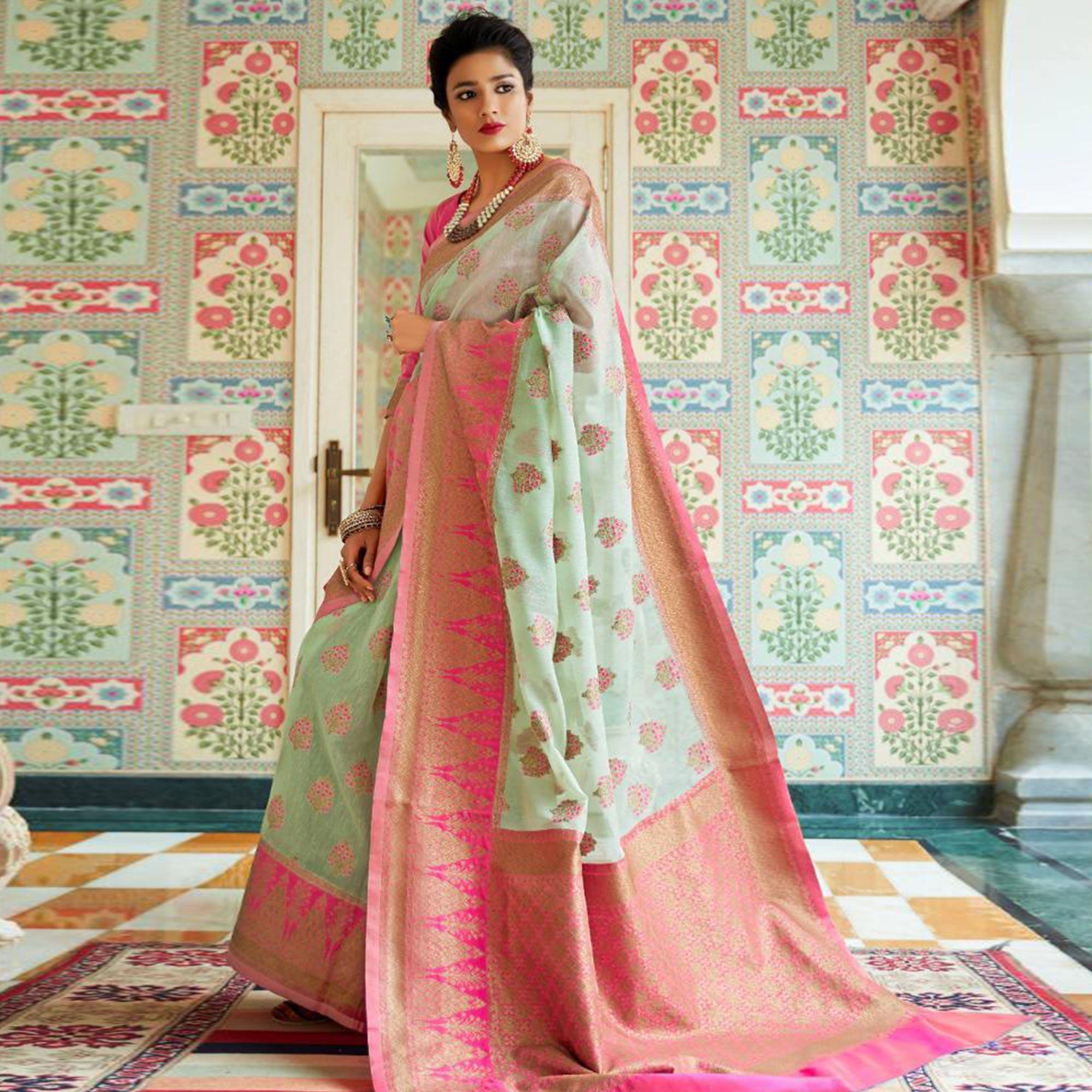 Graceful Aqua Green Colored Festive Wear Woven Linen Saree - Peachmode