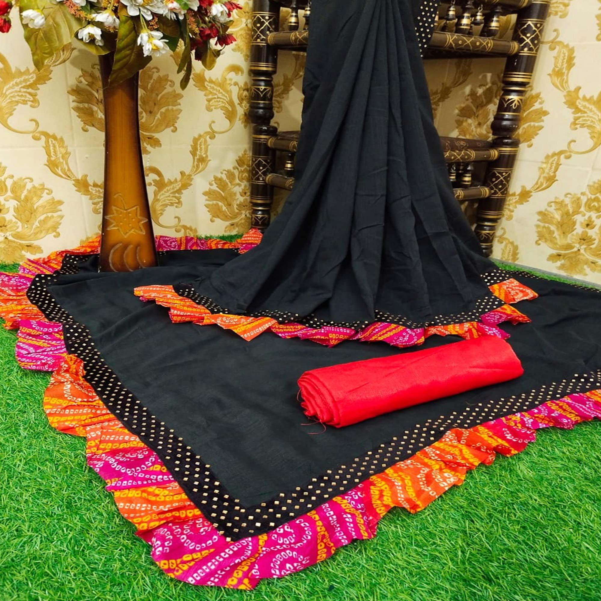 Graceful Black Colored Partywear Solid Vichitra Silk Saree With Bandhani Print Ruffle - Peachmode
