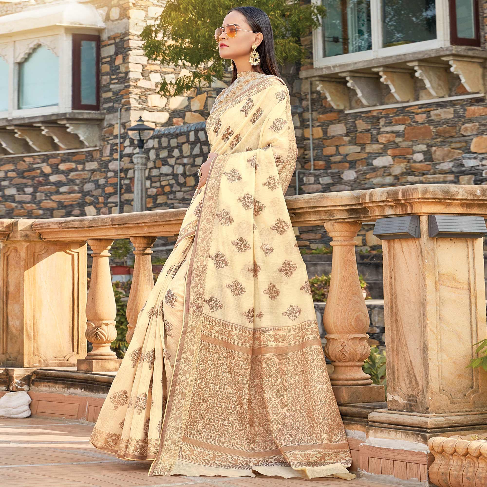 Graceful Cream Colored Festive Wear Woven Cotton Silk Saree - Peachmode