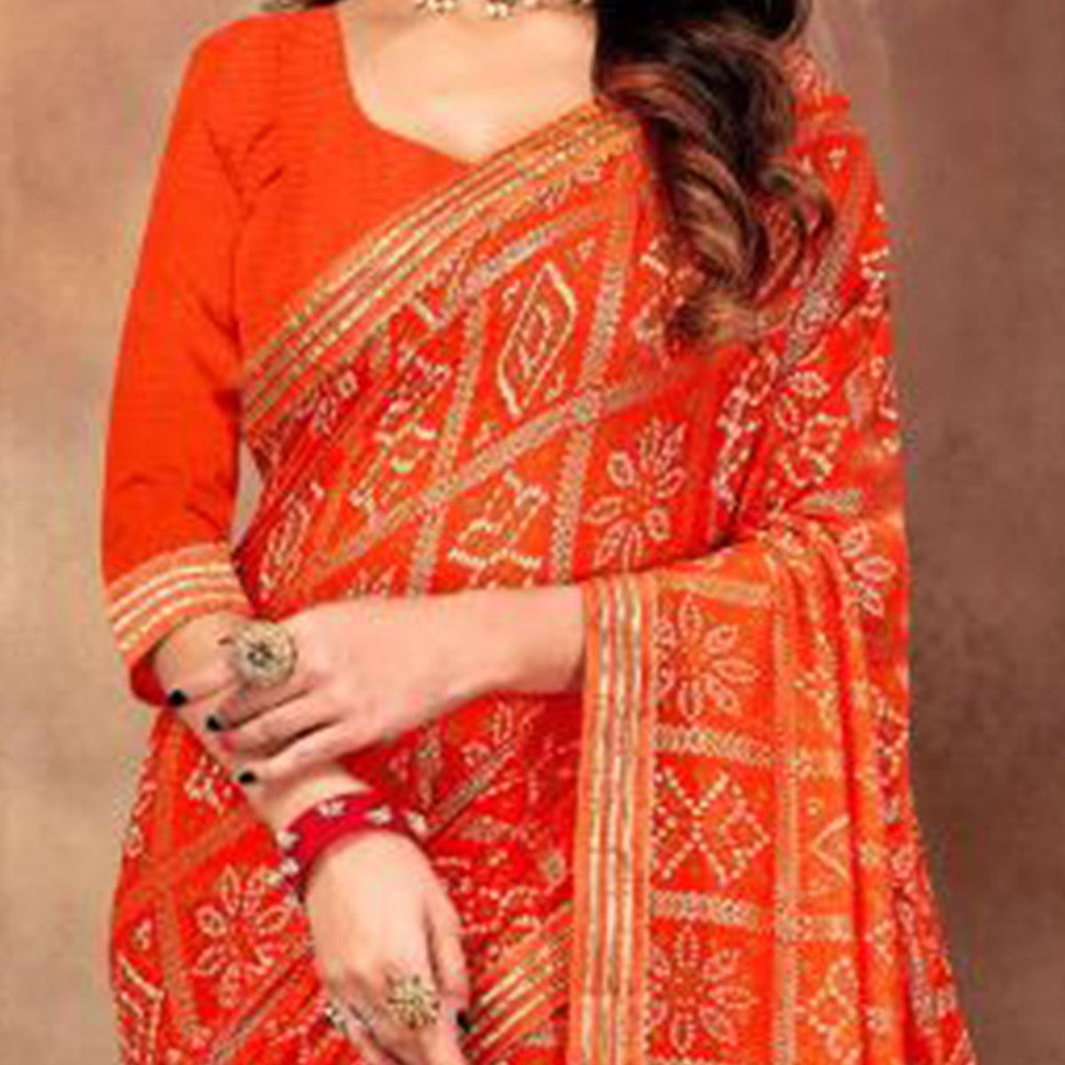 Graceful Orange Colored Festive Wear Bandhani Print With Gotta Border Heavy Georgette Saree - Peachmode