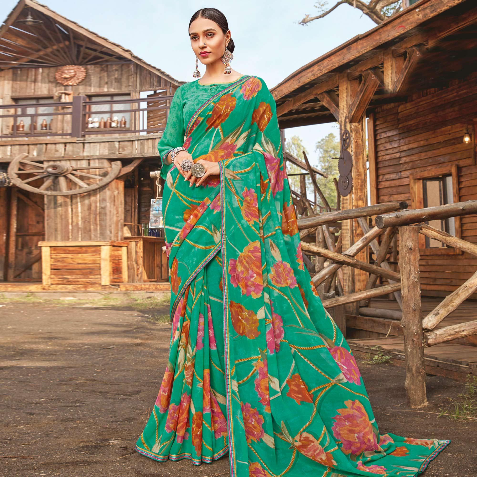 Graceful Rama Green Coloured Partywear Pure Georgette Floral Printed Saree With Fancy Lace Border - Peachmode