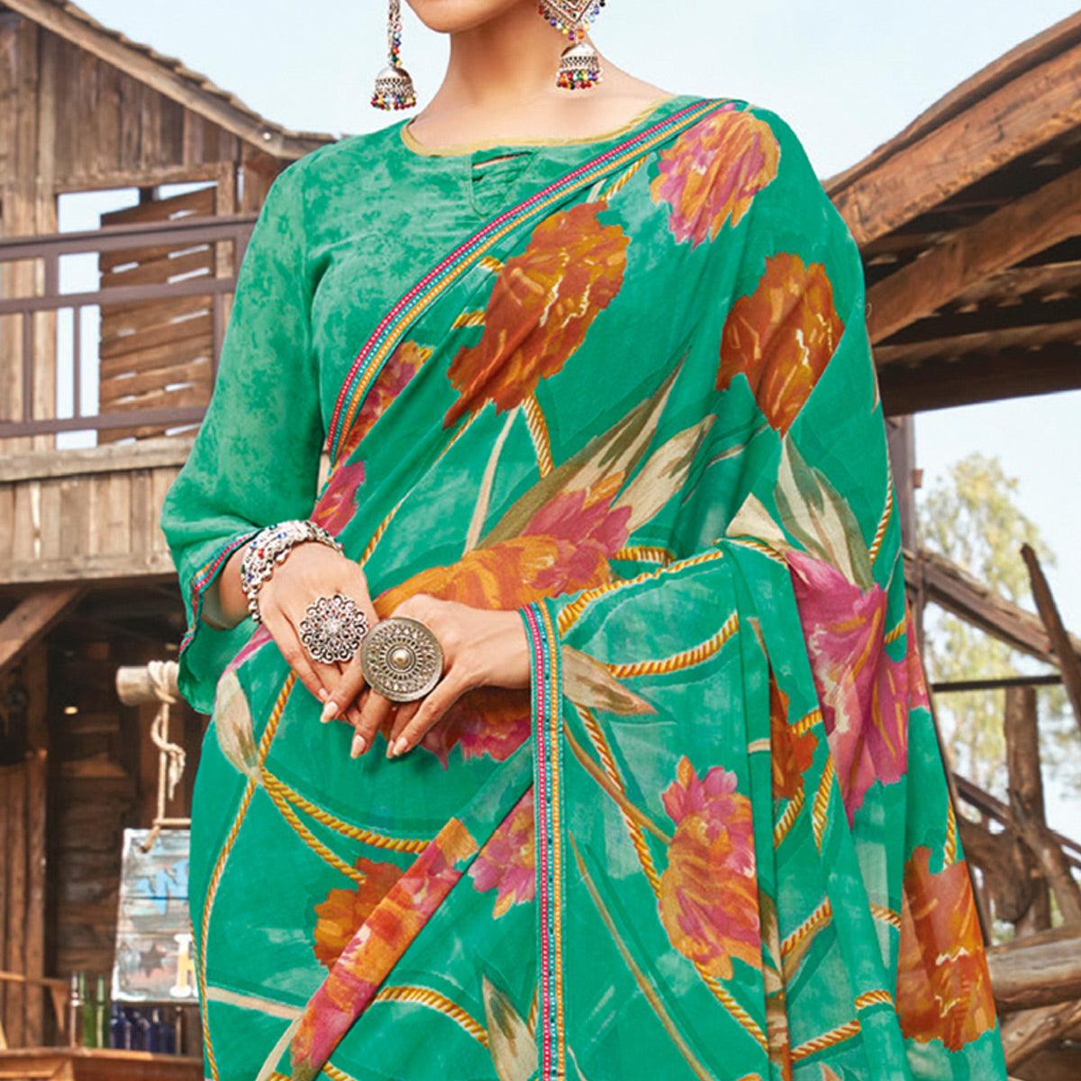 Graceful Rama Green Coloured Partywear Pure Georgette Floral Printed Saree With Fancy Lace Border - Peachmode