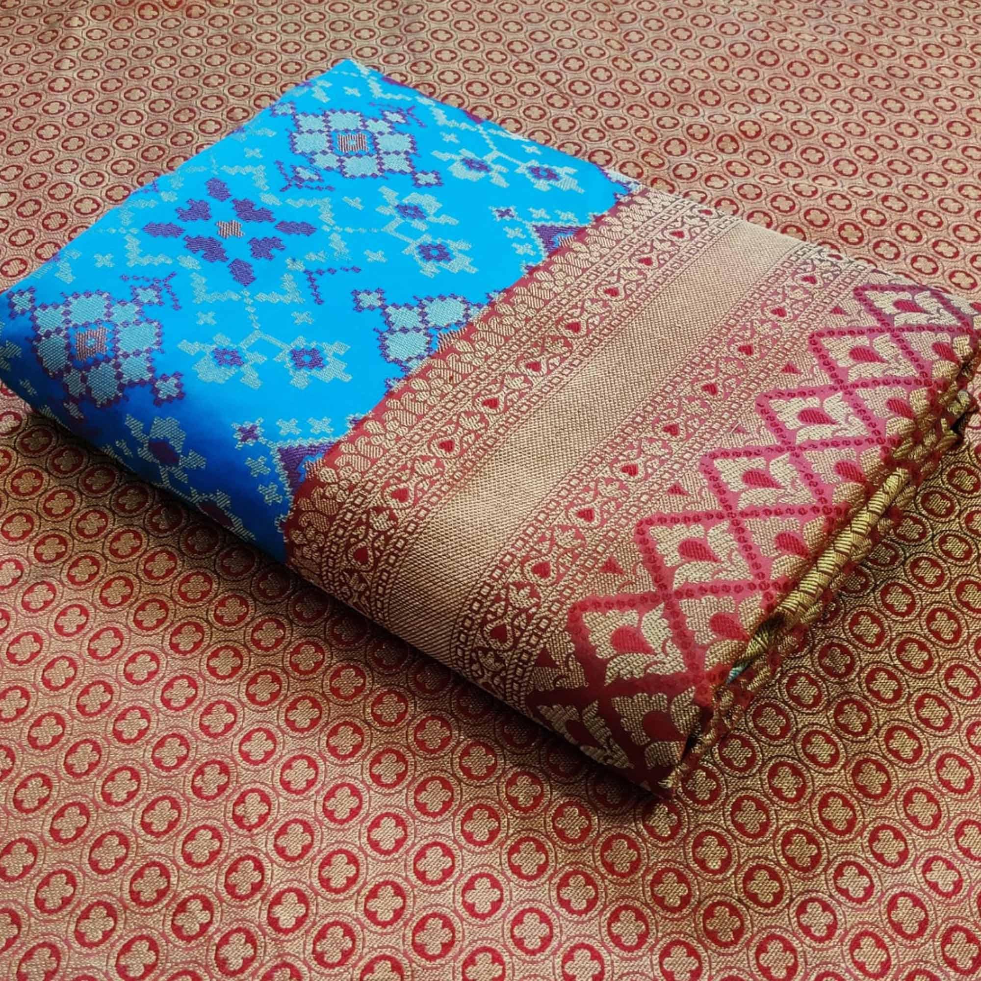 Graceful Sky Blue Colored Festive Wear Woven Patola Silk Saree - Peachmode