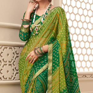 Green Casual Wear Bandhani Printed Chiffon Saree With Tassels - Peachmode