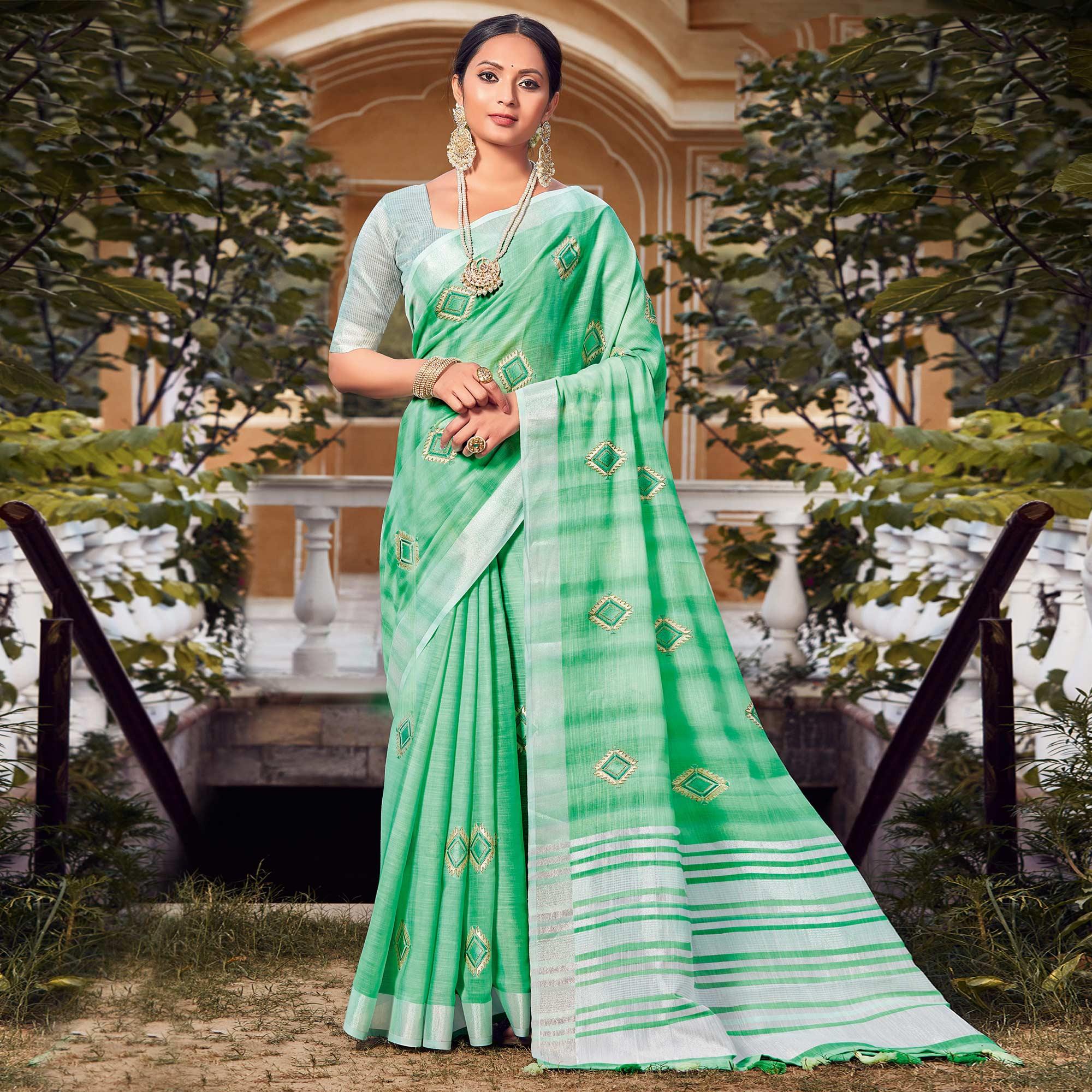 Green Festive Wear Embroidered Linen Saree - Peachmode