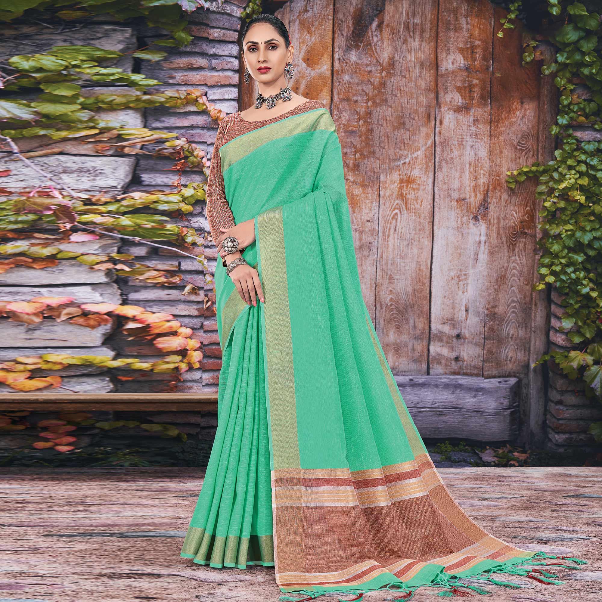 Green Festive Wear Solid Linen Saree - Peachmode