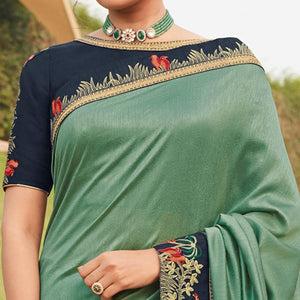 Green Festive Wear Woven Silk Saree With Border - Peachmode