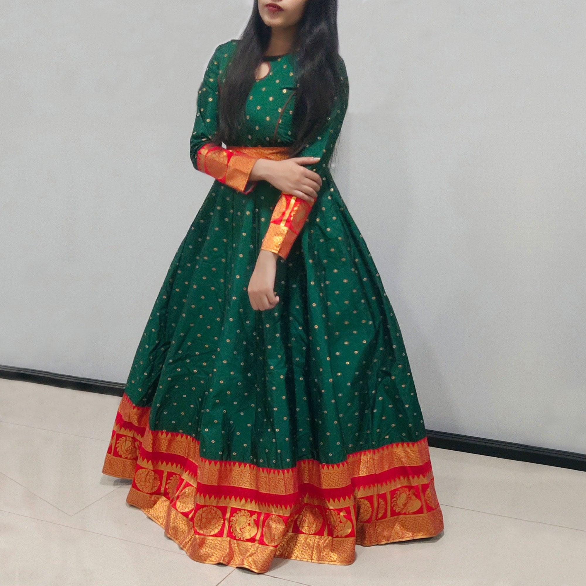 Green Festive Wear Woven Tapetta Silk Gown - Peachmode