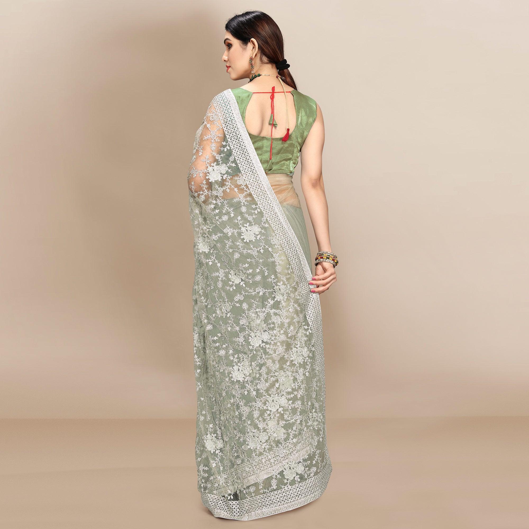 Green Partywear Floral Embroidered Soft Net Saree - Peachmode